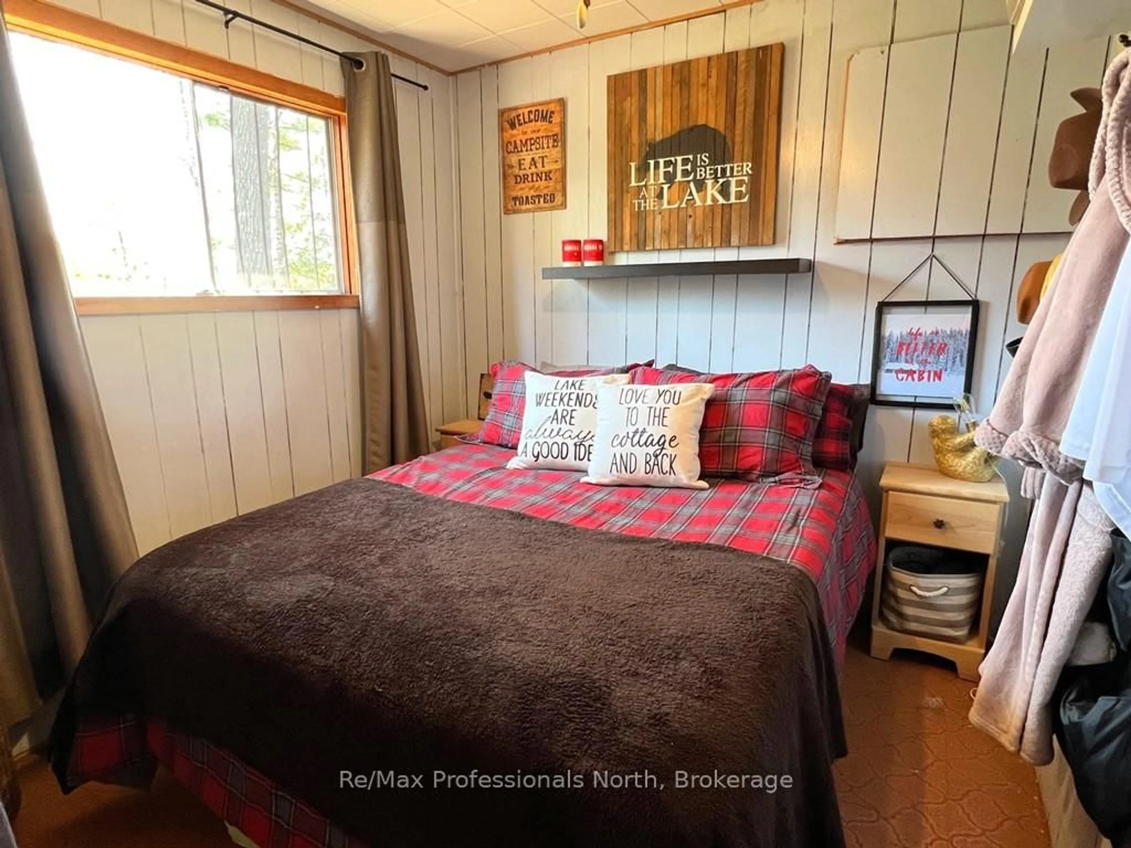 Bedroom with bed, wood/laminate floor for 1411 Clement Lake Rd, Highlands East Ontario K0L 3C0
