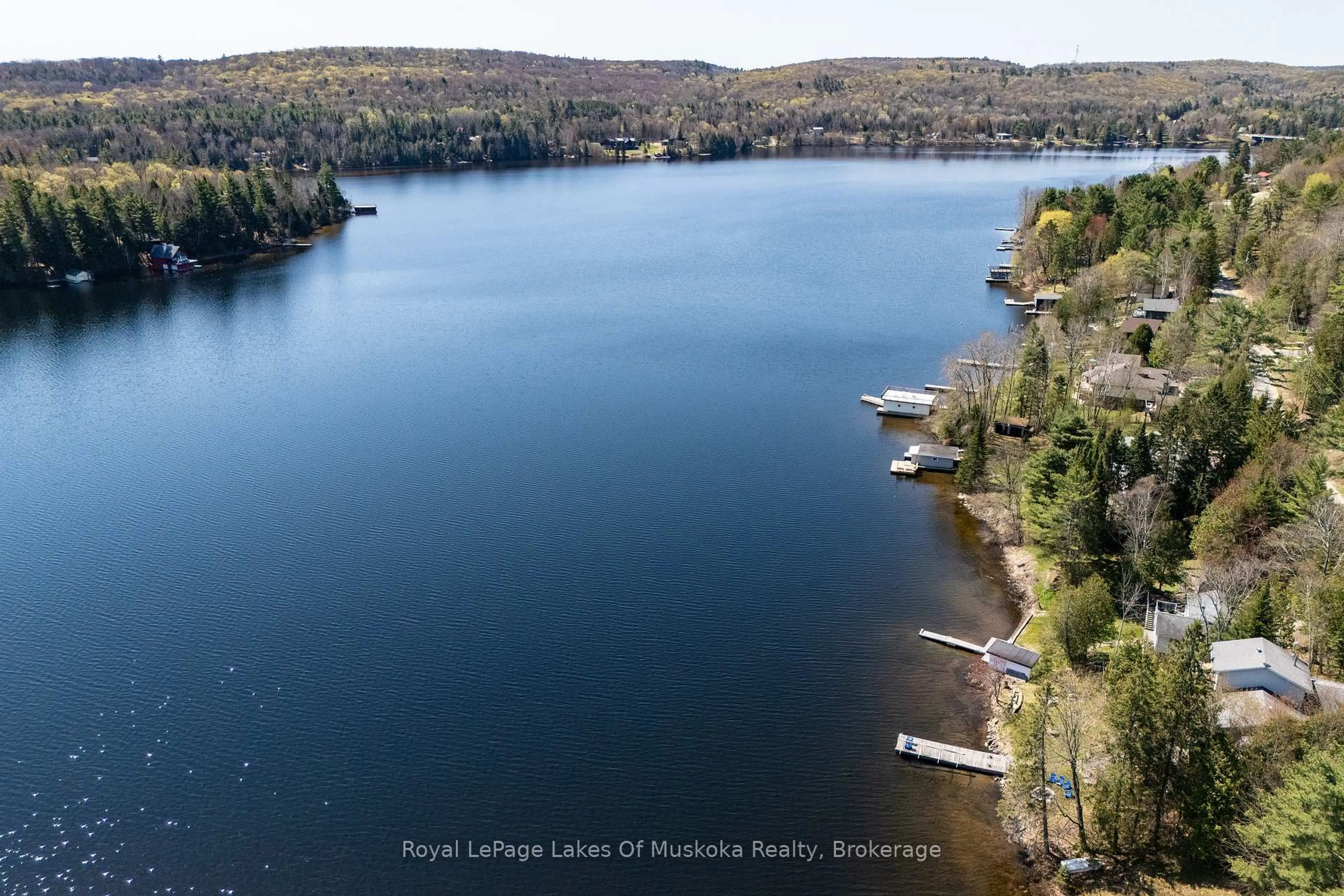 A pic from outside/outdoor area/front of a property/back of a property/a pic from drone, water/lake/river/ocean view for 1128 Kawagama Lake Rd, Algonquin Highlands Ontario P0A 1E0