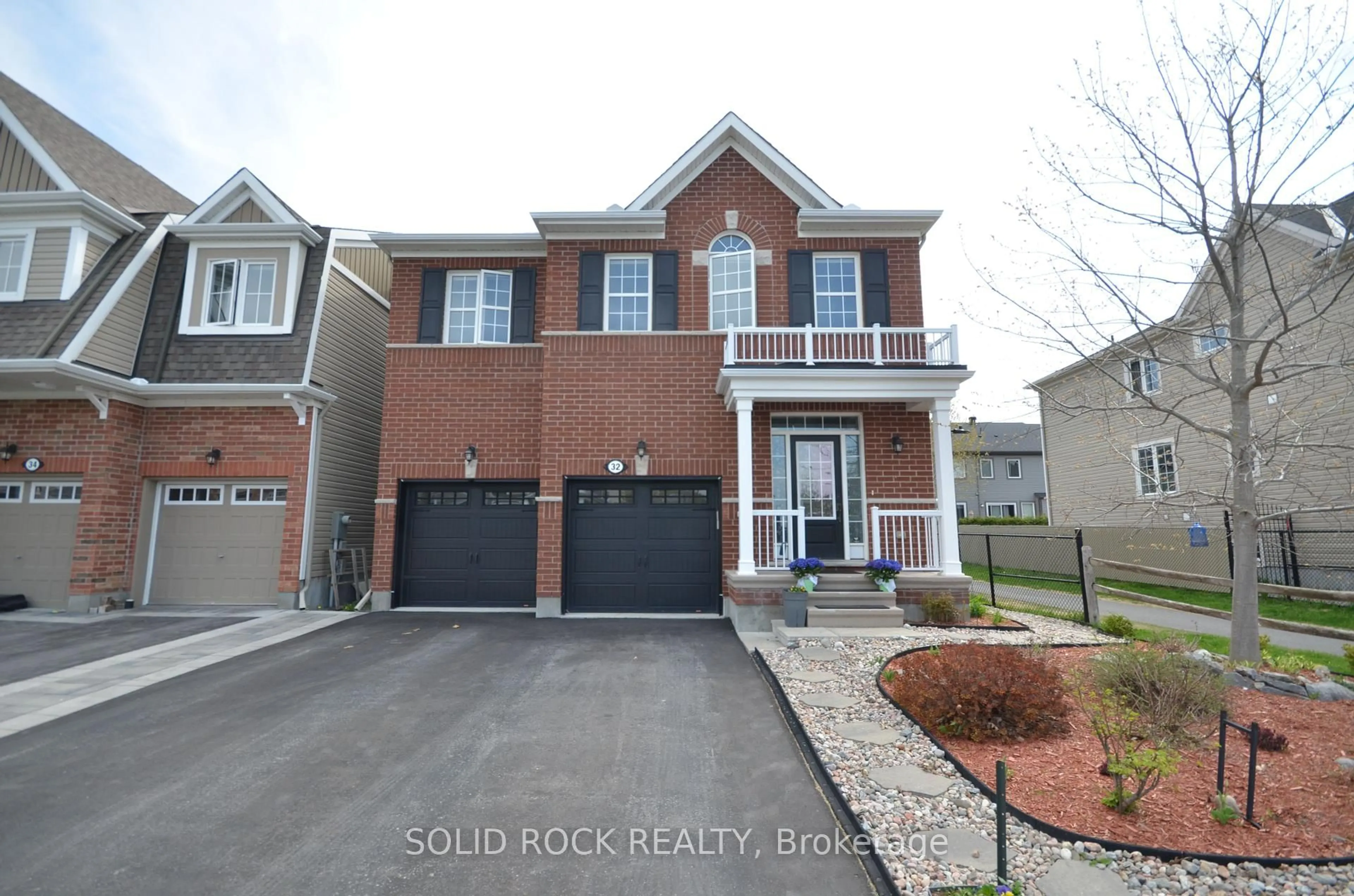 Home with brick exterior material, street for 32 Solaris Dr, Ottawa Ontario K2M 0L6