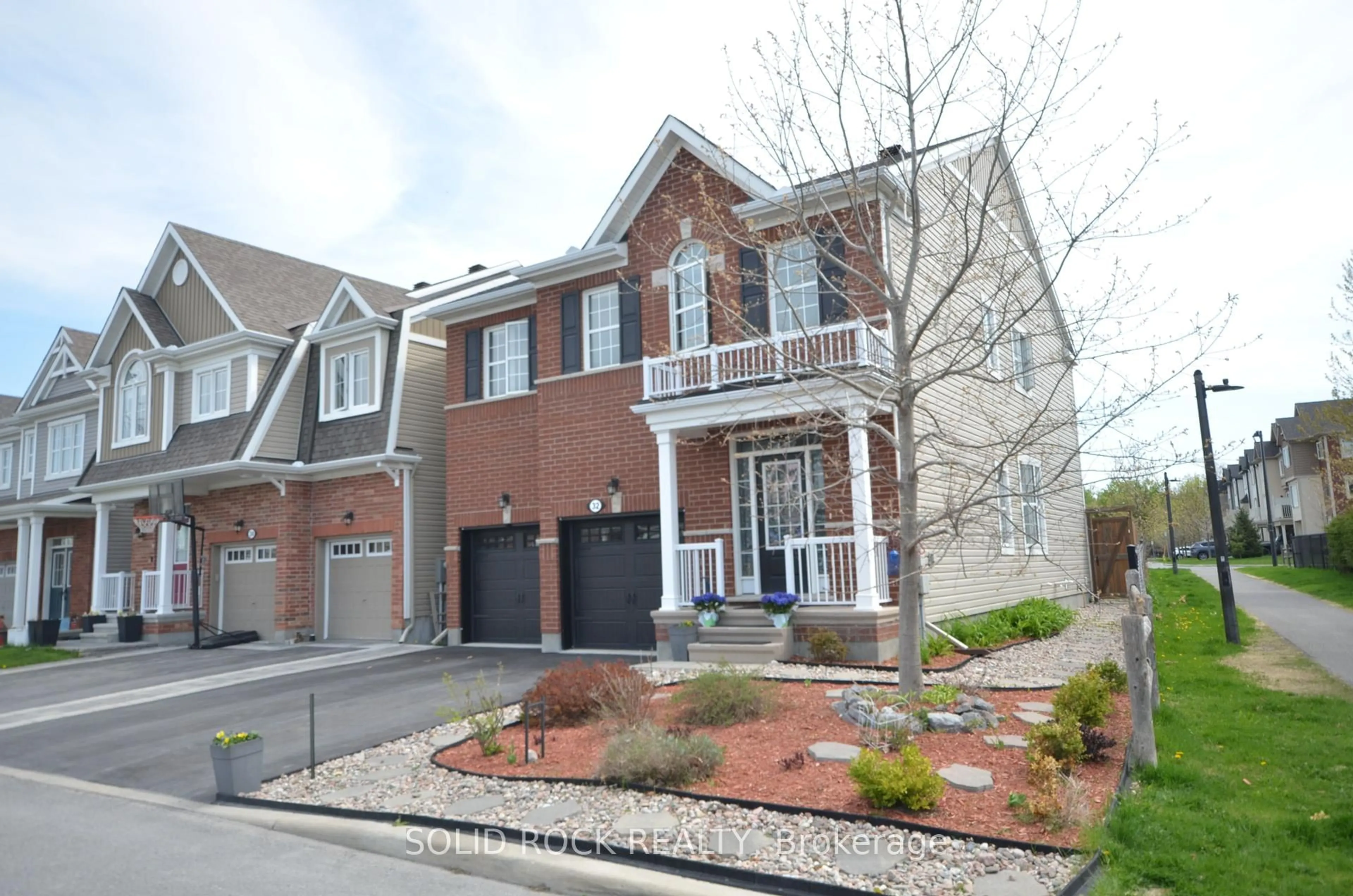 Home with brick exterior material, street for 32 Solaris Dr, Ottawa Ontario K2M 0L6