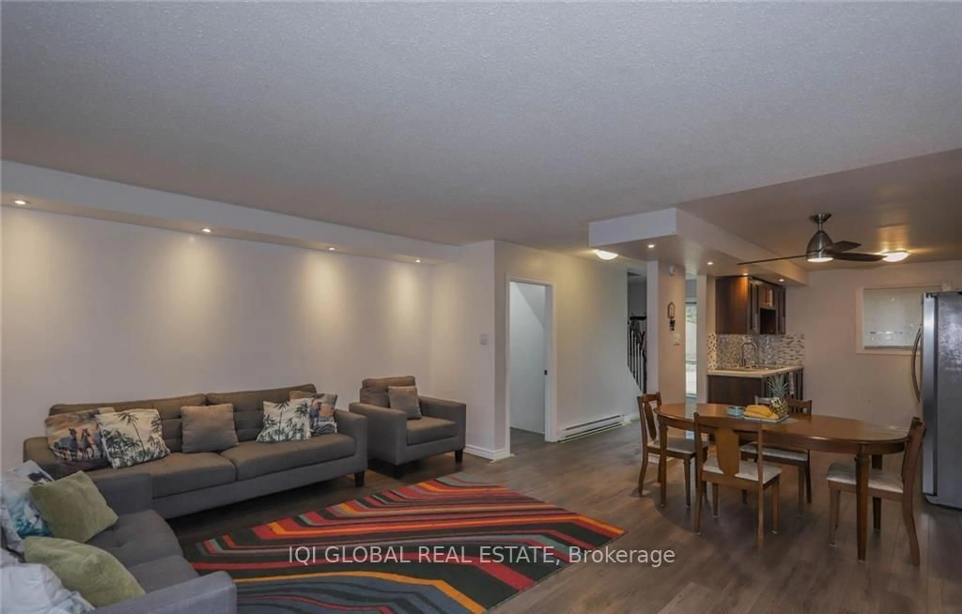 Living room with furniture, wood/laminate floor for 1775 Culver Dr, London East Ontario N5V 3H6