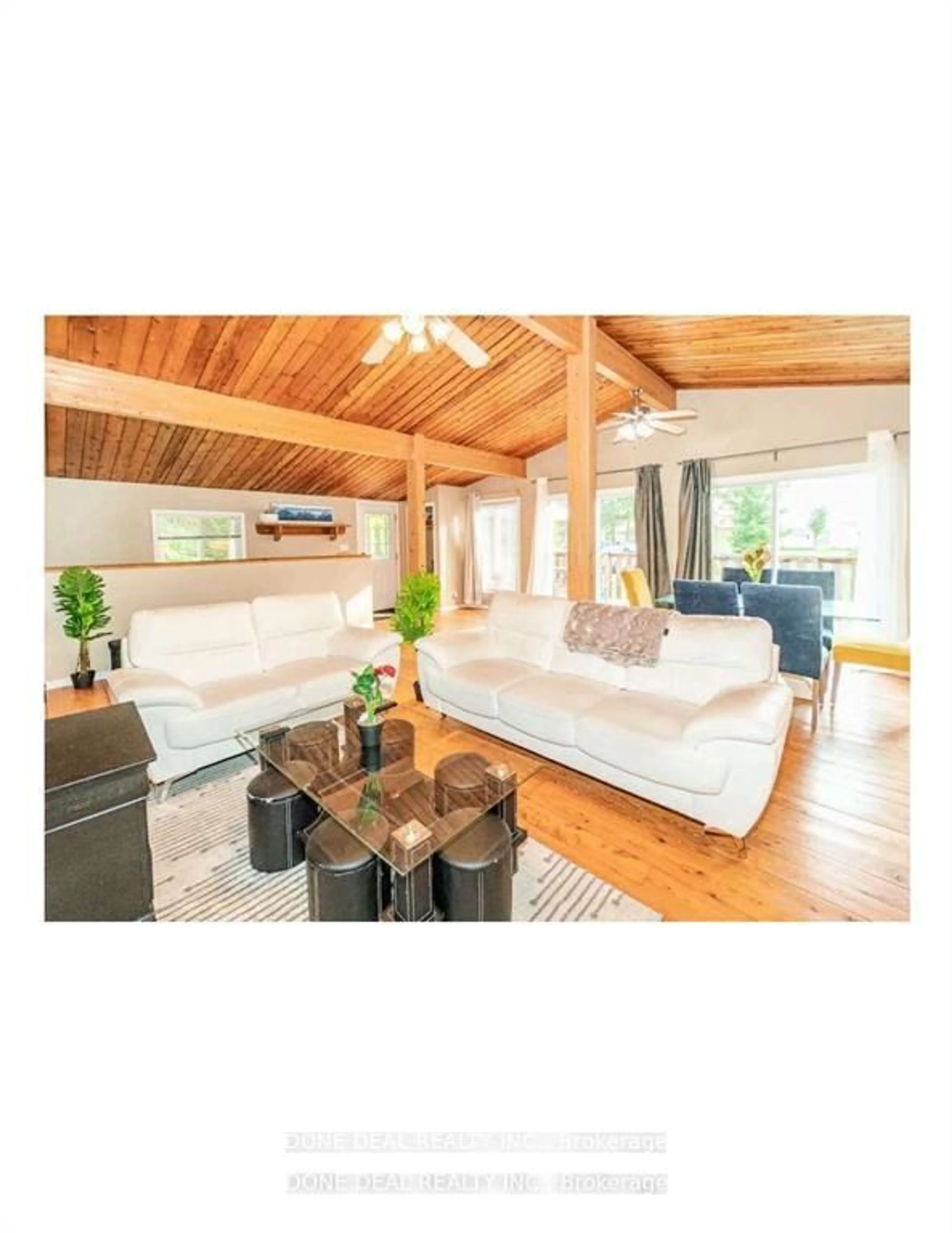 Living room with furniture, wood/laminate floor for 179 Chapman Dr, Magnetawan Ontario P0A 1C0