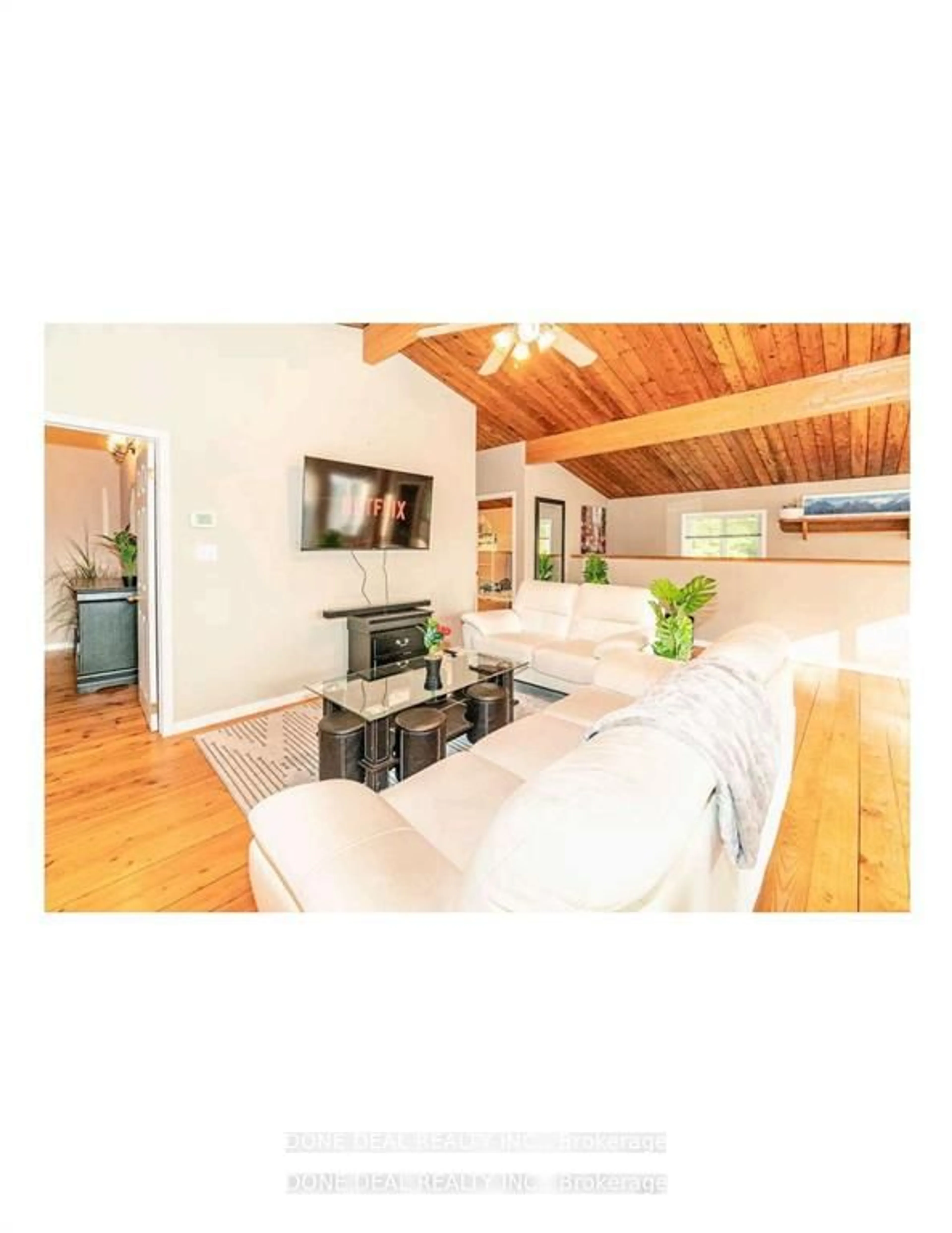 Living room with furniture, wood/laminate floor for 179 Chapman Dr, Magnetawan Ontario P0A 1C0