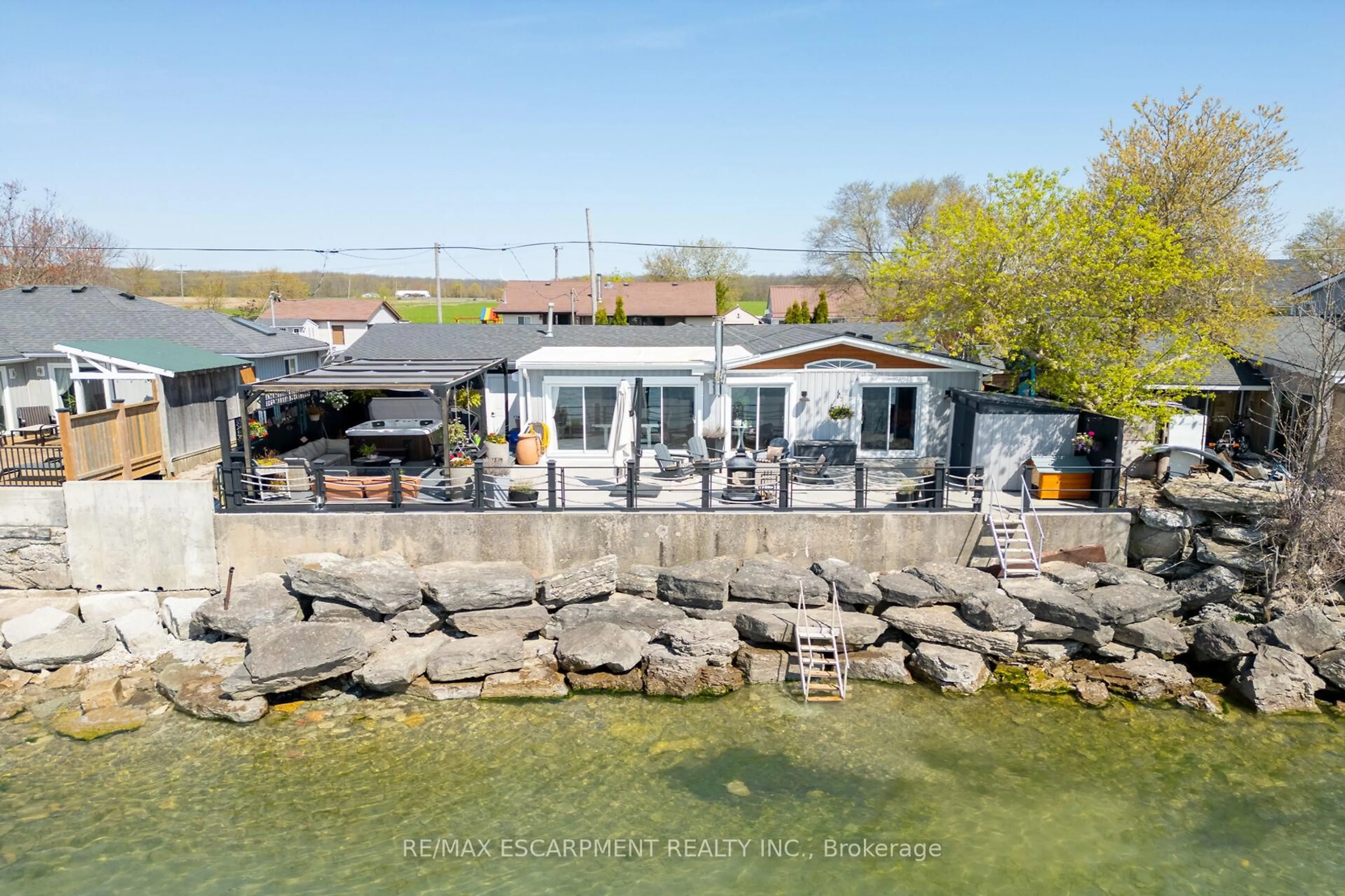 A pic from outside/outdoor area/front of a property/back of a property/a pic from drone, water/lake/river/ocean view for 1200 Lakeshore Rd, Haldimand Ontario N0A 1P0