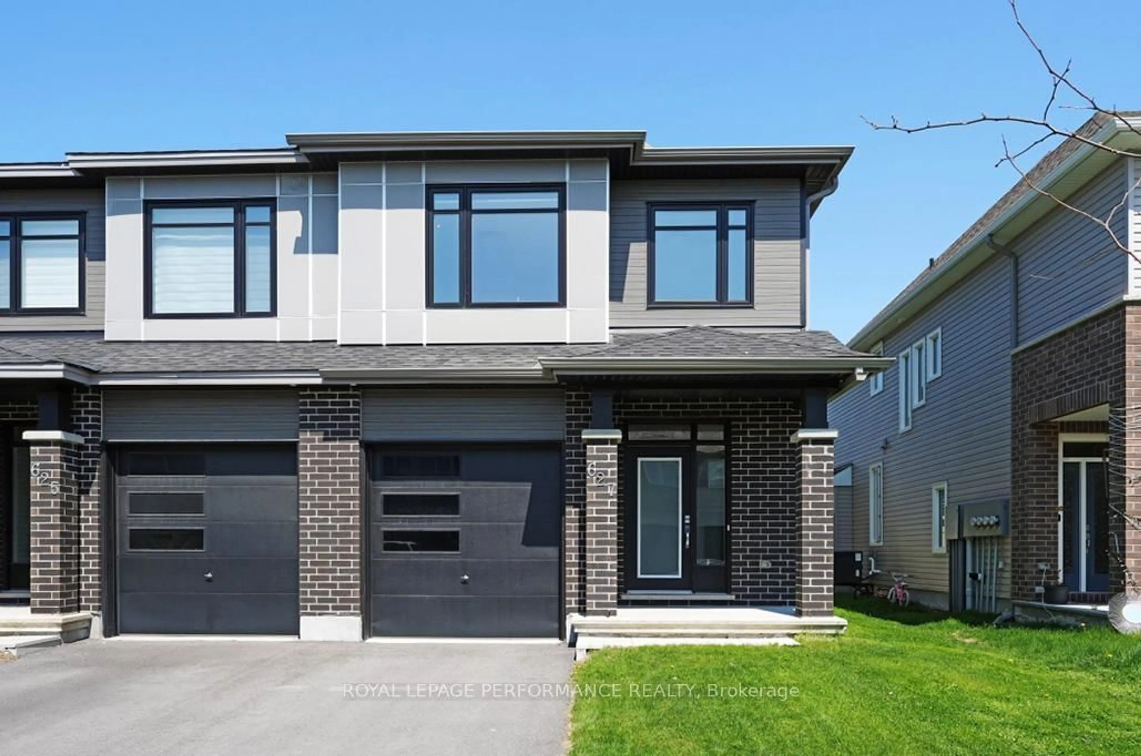 Home with brick exterior material, street for 627 Taliesin Cres, Ottawa Ontario K2S 2W5