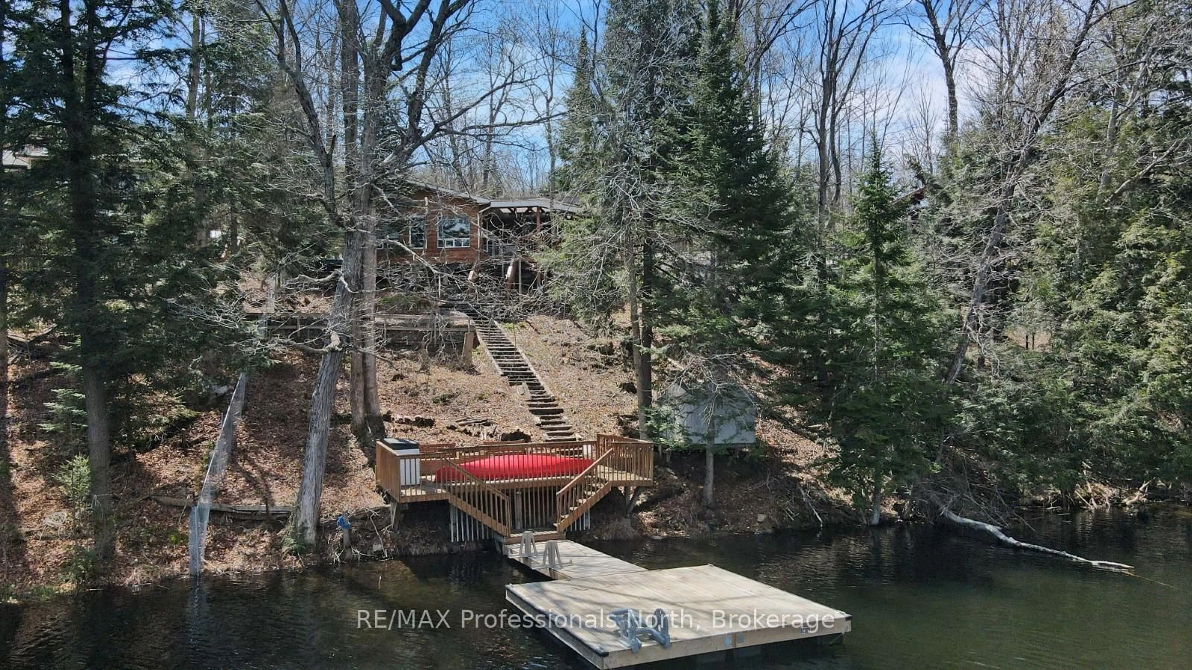 A pic from outside/outdoor area/front of a property/back of a property/a pic from drone, water/lake/river/ocean view for 1039 Mink Rd, Dysart et al Ontario K0M 1S0