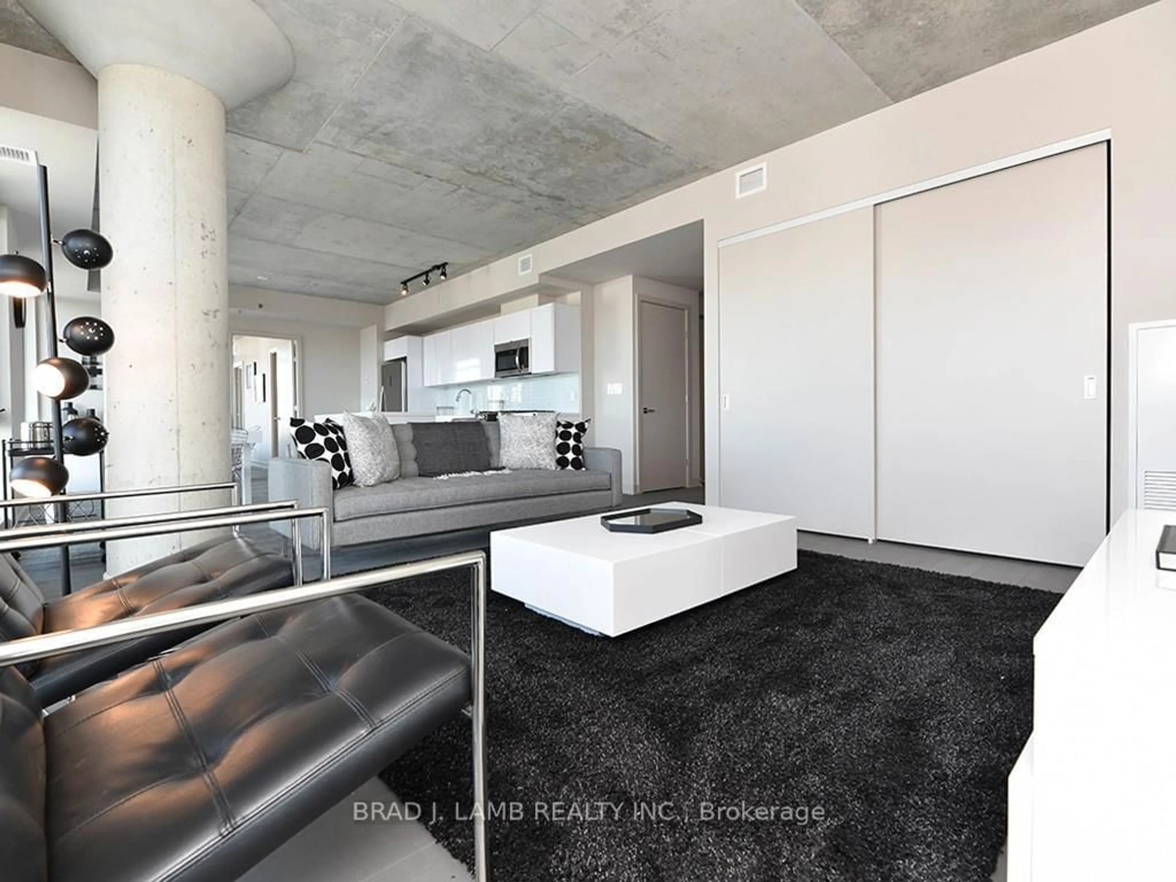 Living room with furniture, cement floor for 203 CATHERINE St #614, Ottawa Ontario K2P 1C3