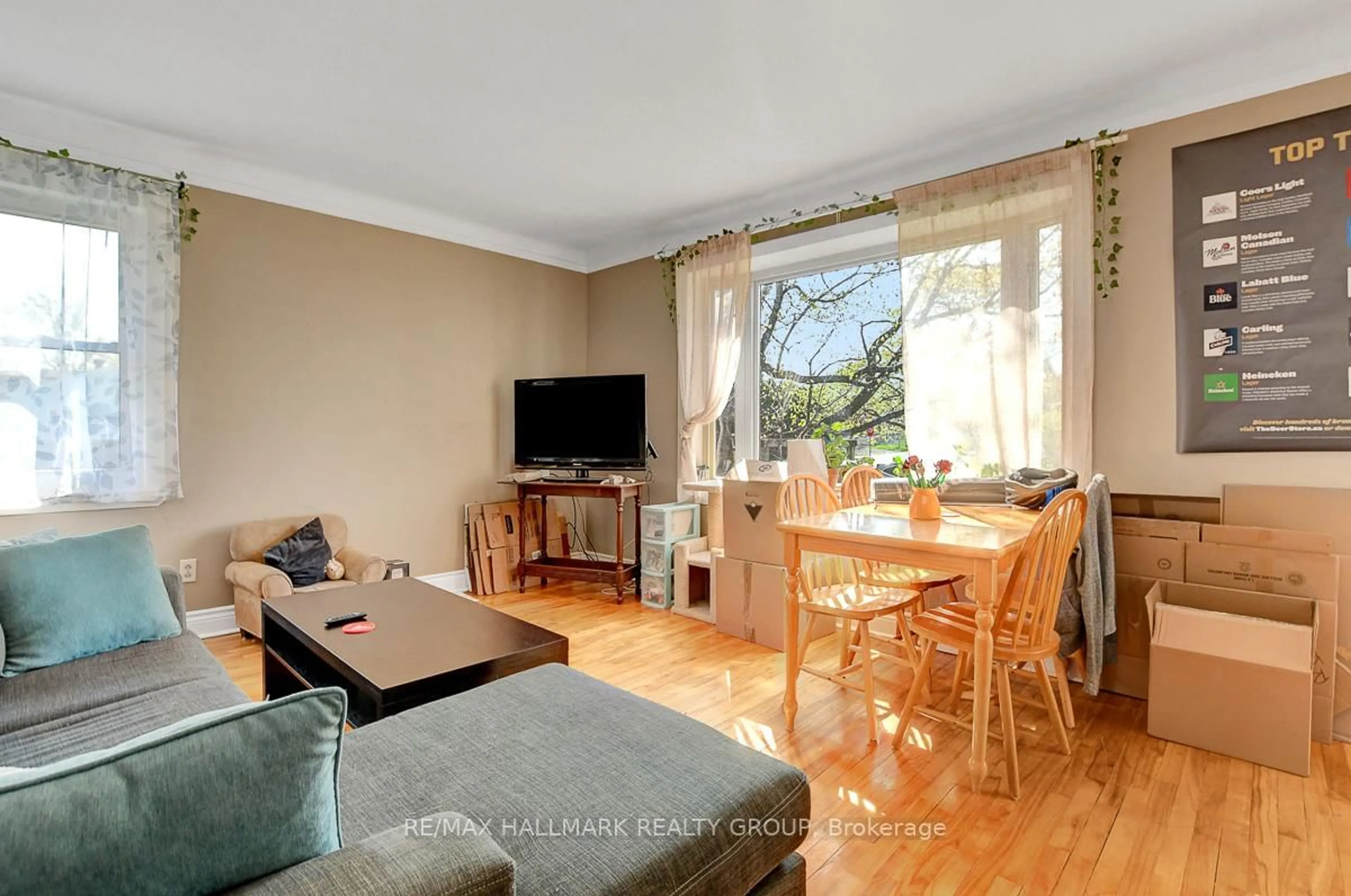 Living room with furniture, wood/laminate floor for 89 Tower Rd, Ottawa Ontario K2G 2G1