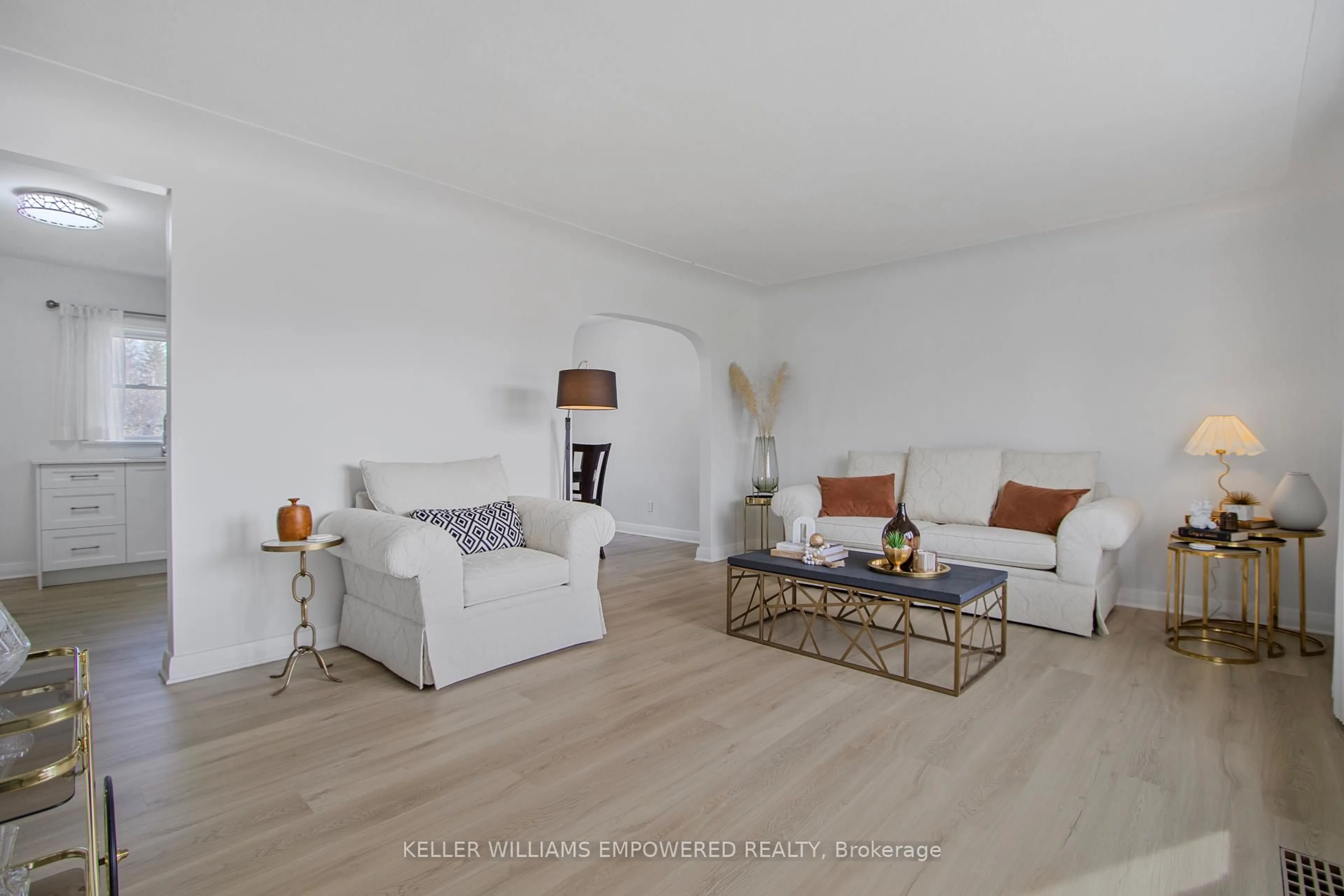 Living room with furniture, wood/laminate floor for 711 Bowan St, Strathroy-Caradoc Ontario N0L 1W0