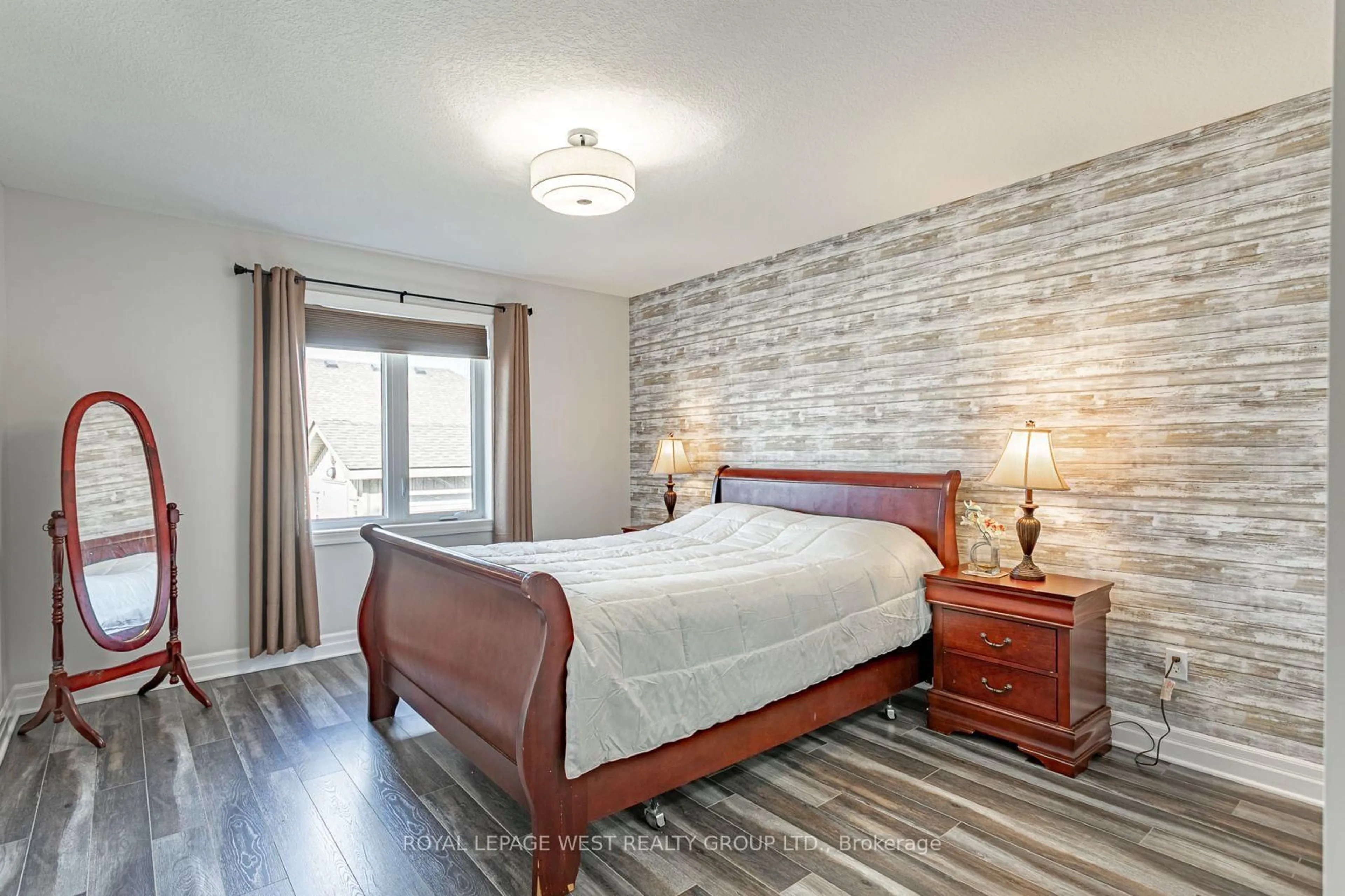 Bedroom with bed, wood/laminate floor for 25 Hollingshead Rd, Ingersoll Ontario N5C 1B5