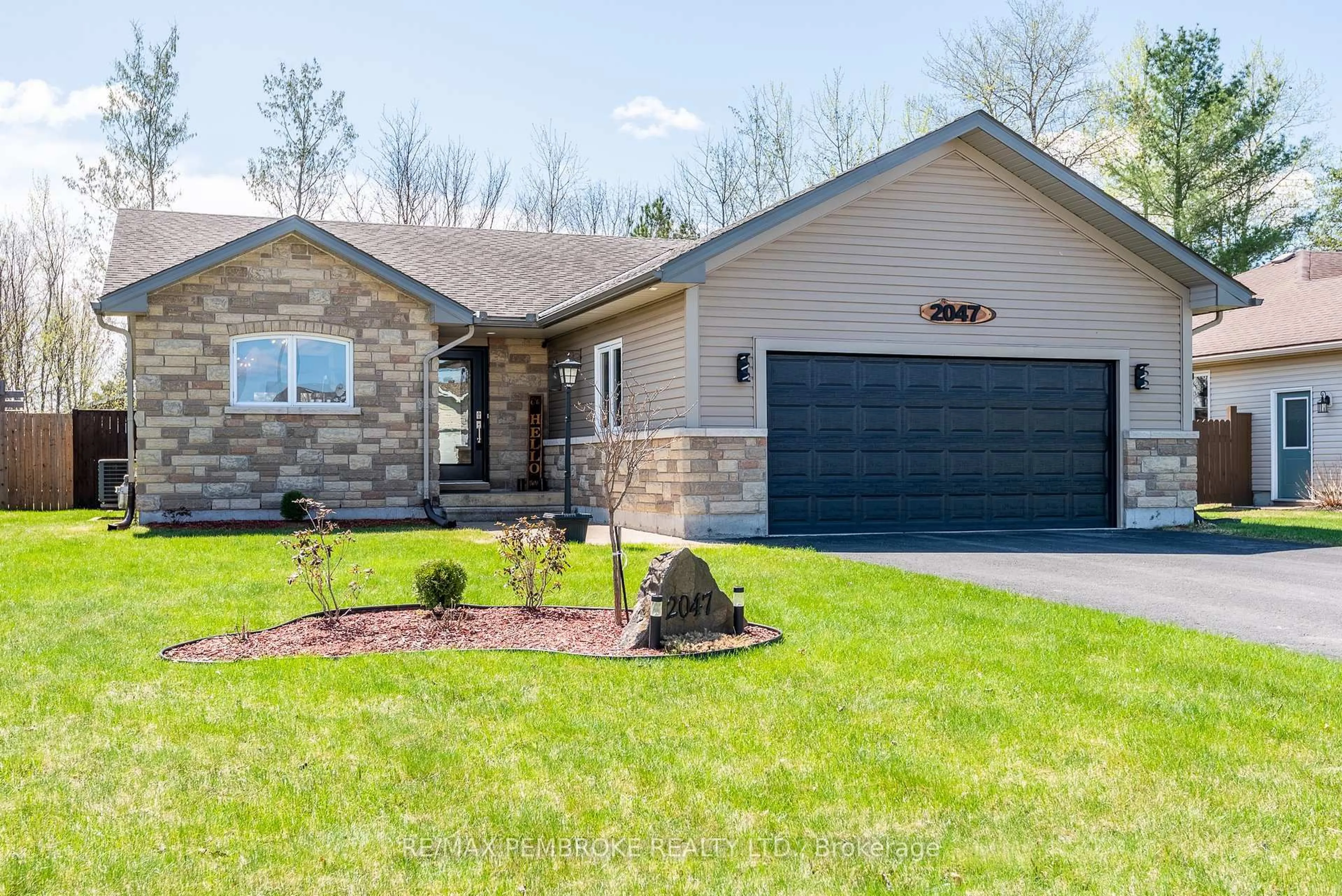 Home with brick exterior material, street for 2047 Sandstone Cres, Petawawa Ontario K8H 0B2
