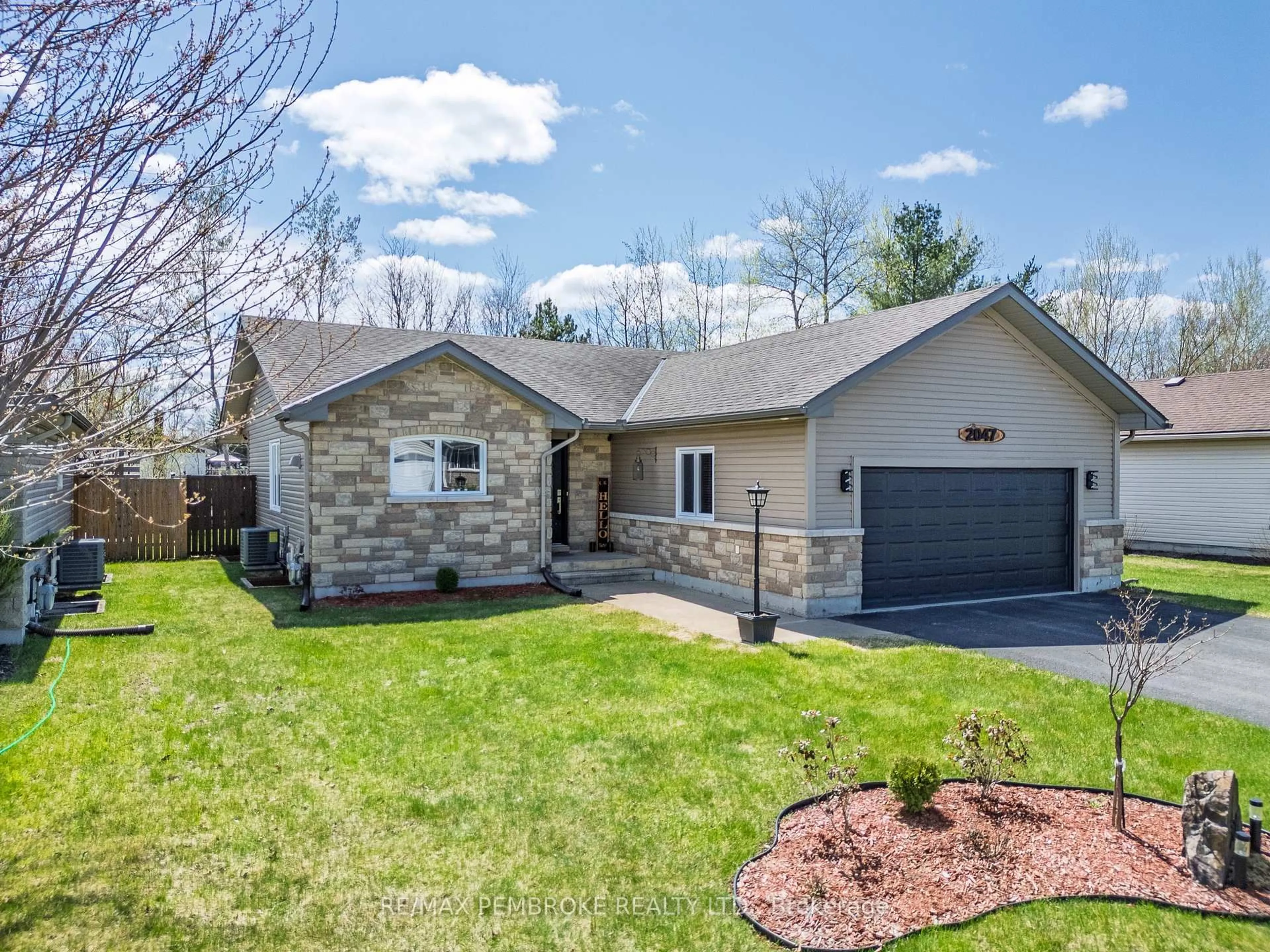 Home with brick exterior material, street for 2047 Sandstone Cres, Petawawa Ontario K8H 0B2