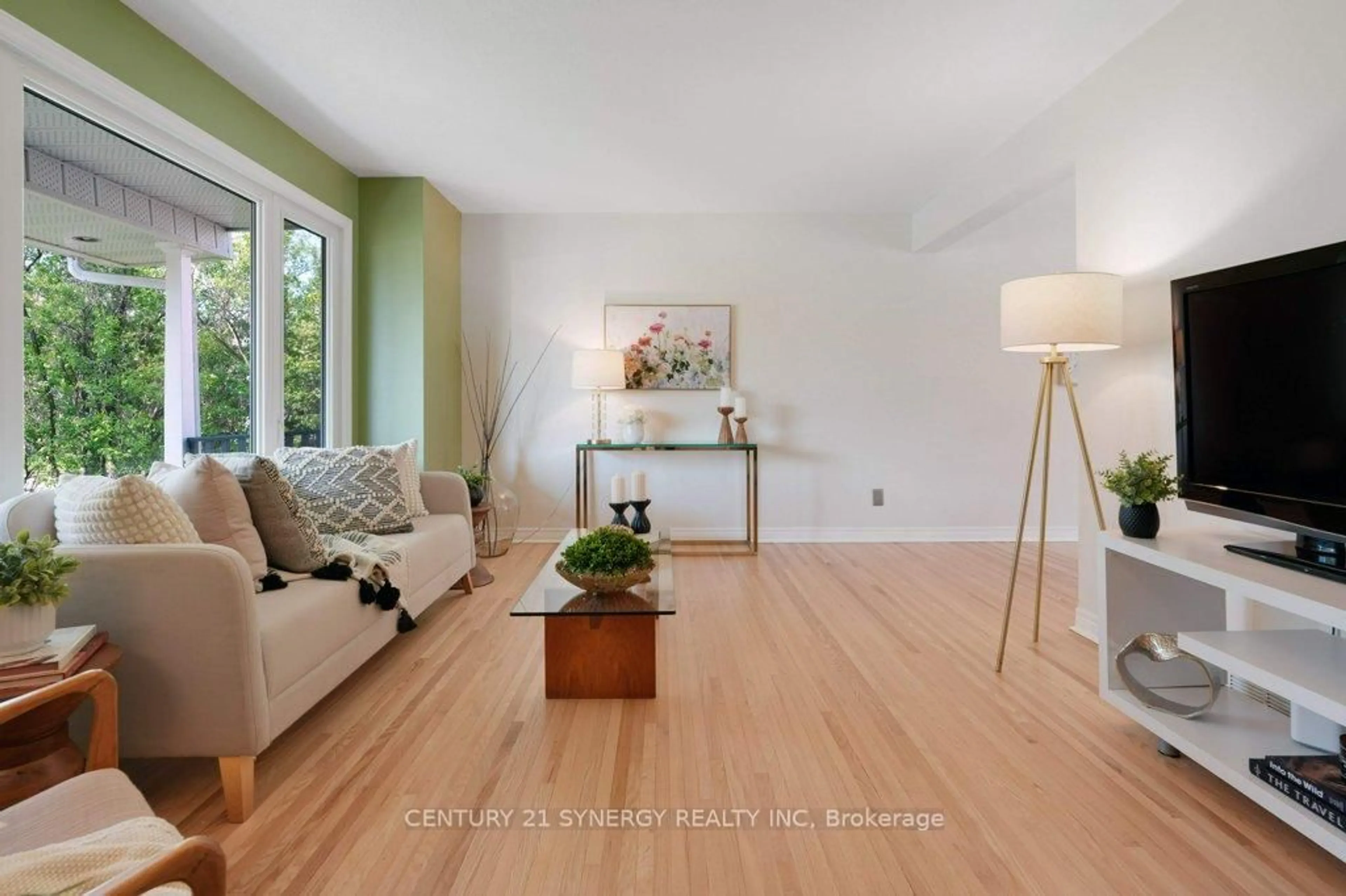 Living room with furniture, wood/laminate floor for 2522 Needham Cres, Ottawa Ontario K1V 6K2