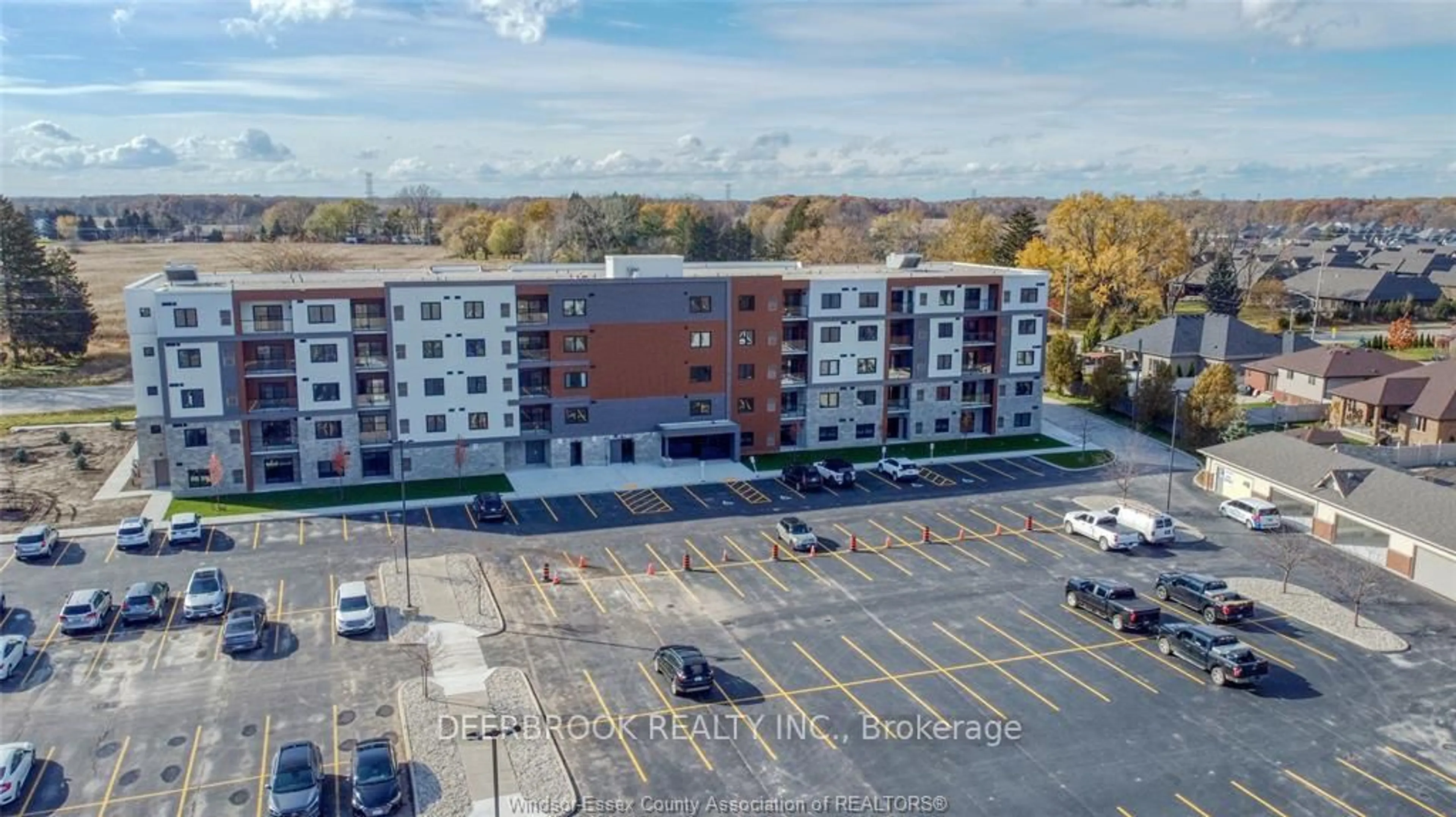 A pic from outside/outdoor area/front of a property/back of a property/a pic from drone, building for 4578 Huron Church Line Rd #313, LaSalle Ontario N9H 0M2