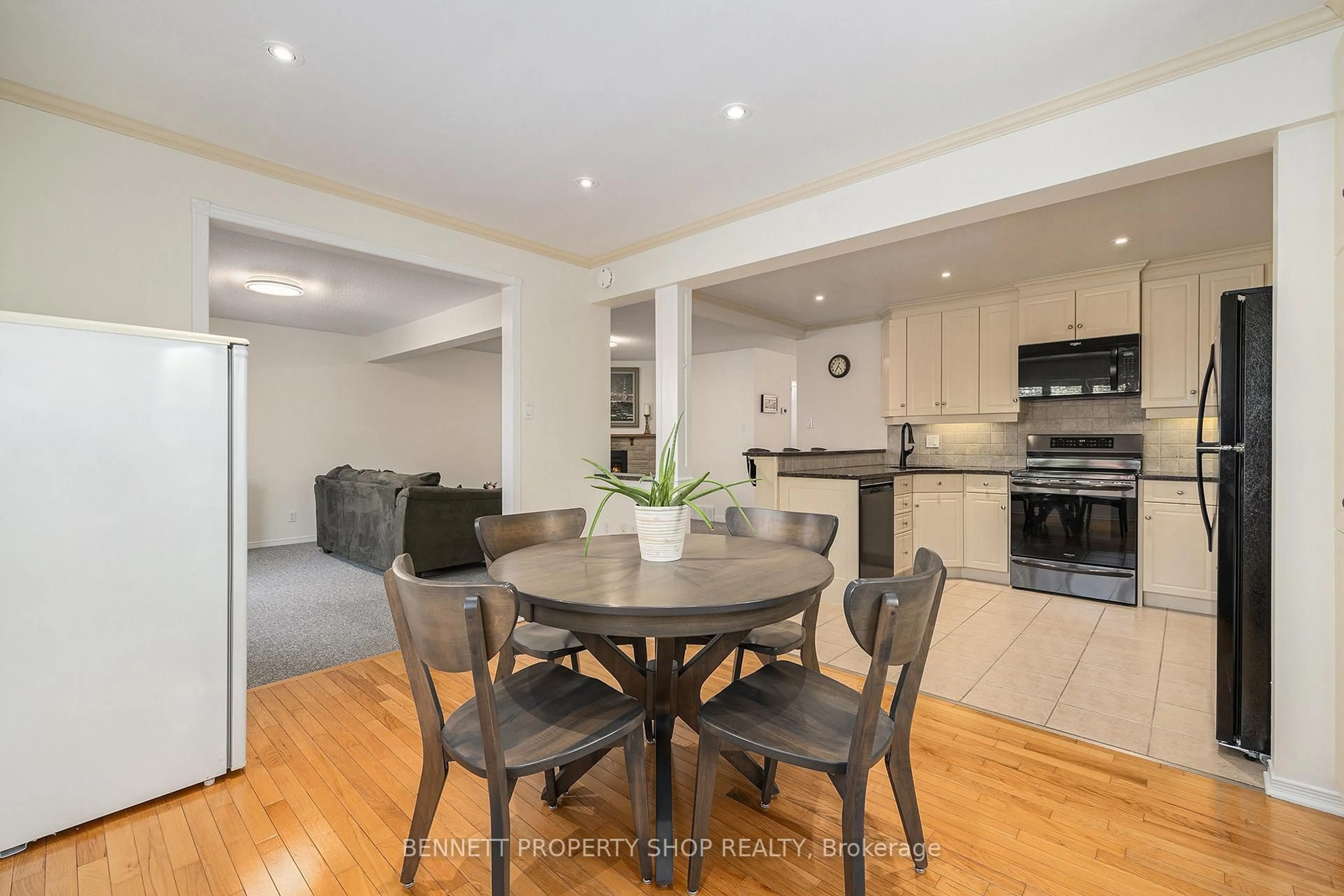Open concept kitchen, wood/laminate floor for 37 Ivylea St, Ottawa Ontario K2G 4X1