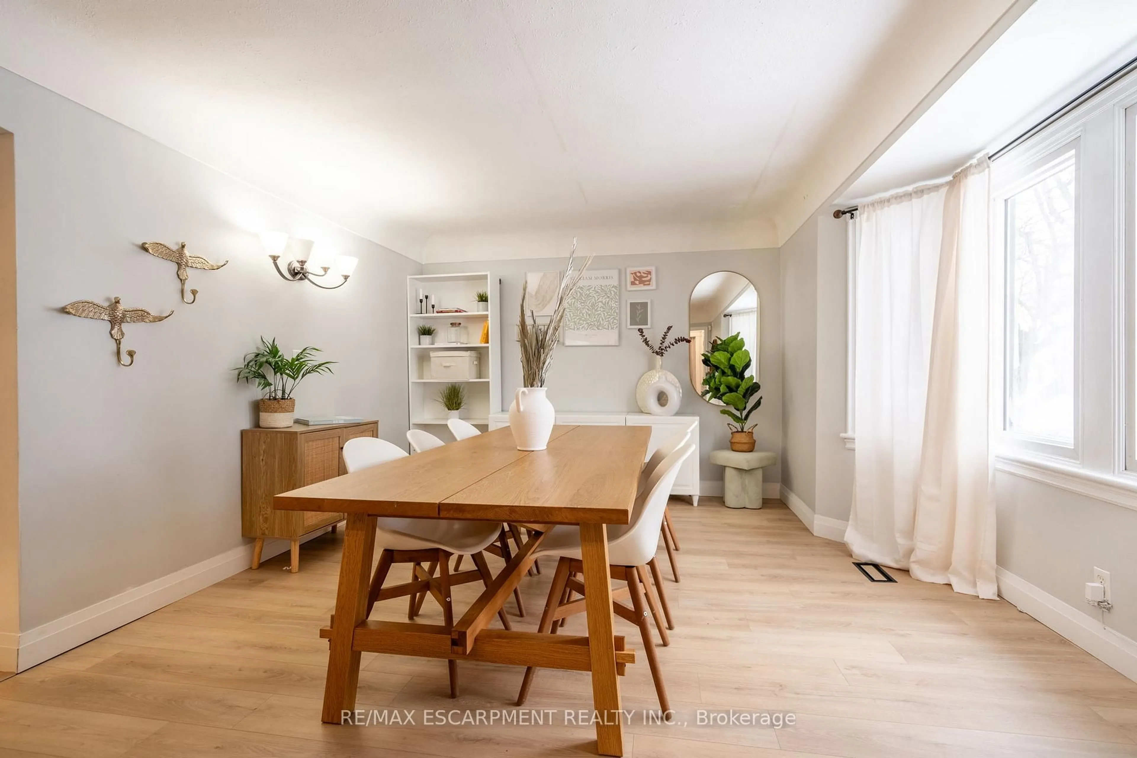Dining room, wood/laminate floor for 351 Queensdale Ave, Hamilton Ontario L9A 1L5
