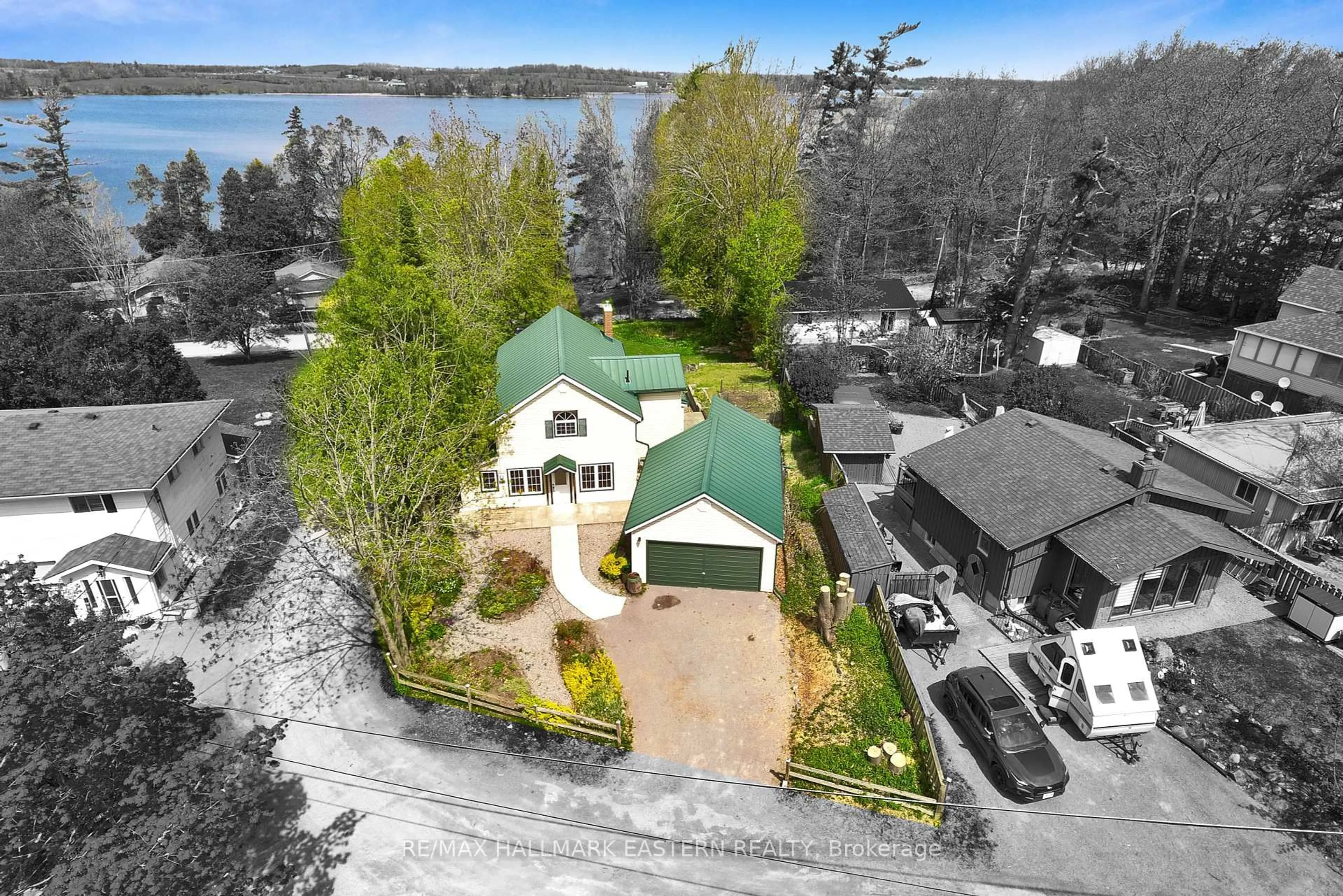A pic from outside/outdoor area/front of a property/back of a property/a pic from drone, water/lake/river/ocean view for 1043 Lakeview Ave, Selwyn Ontario K0L 1H0