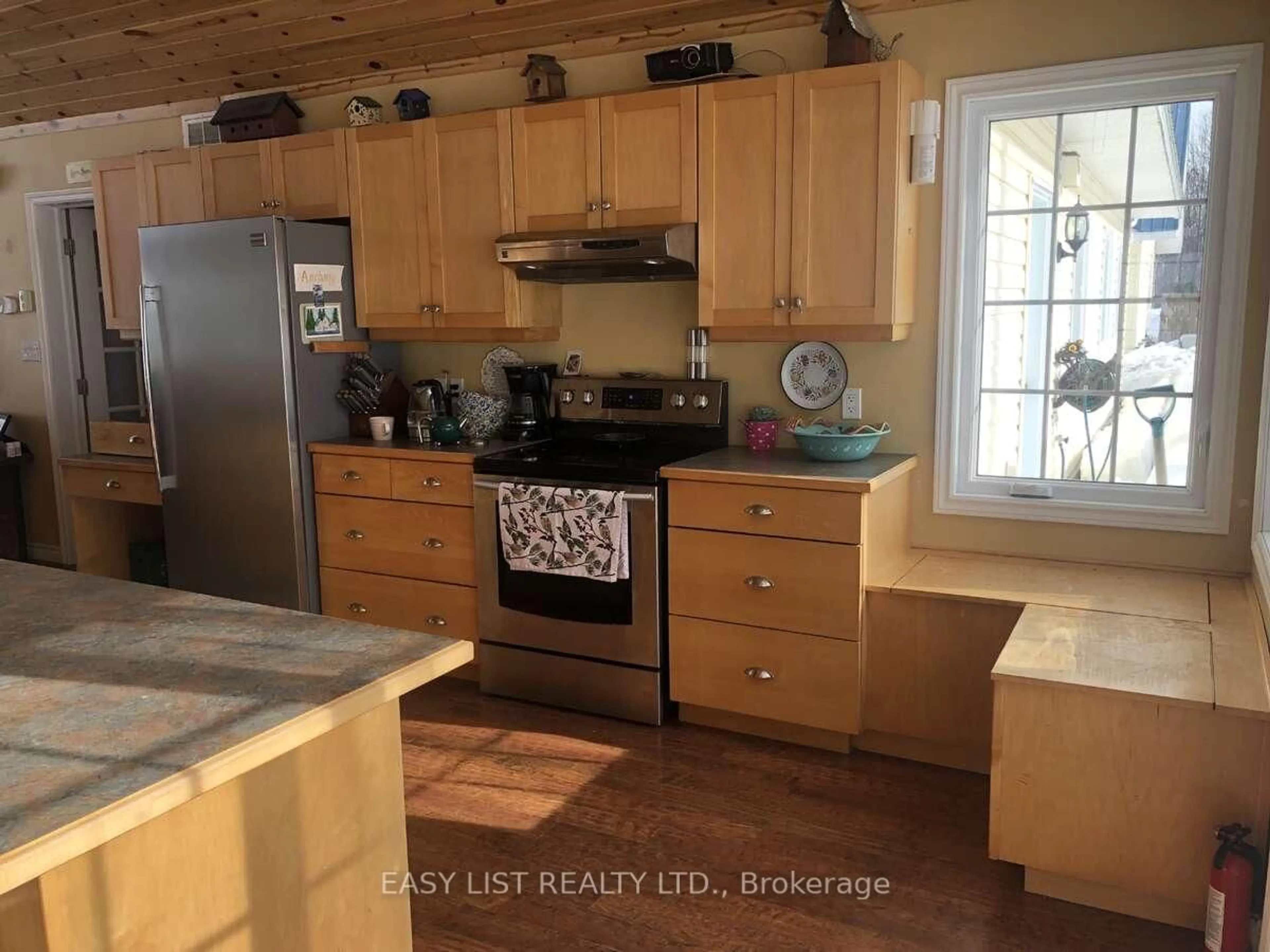 Open concept kitchen, wood/laminate floor for 535 Perrier Rd, Combermere Ontario K0J 1L0