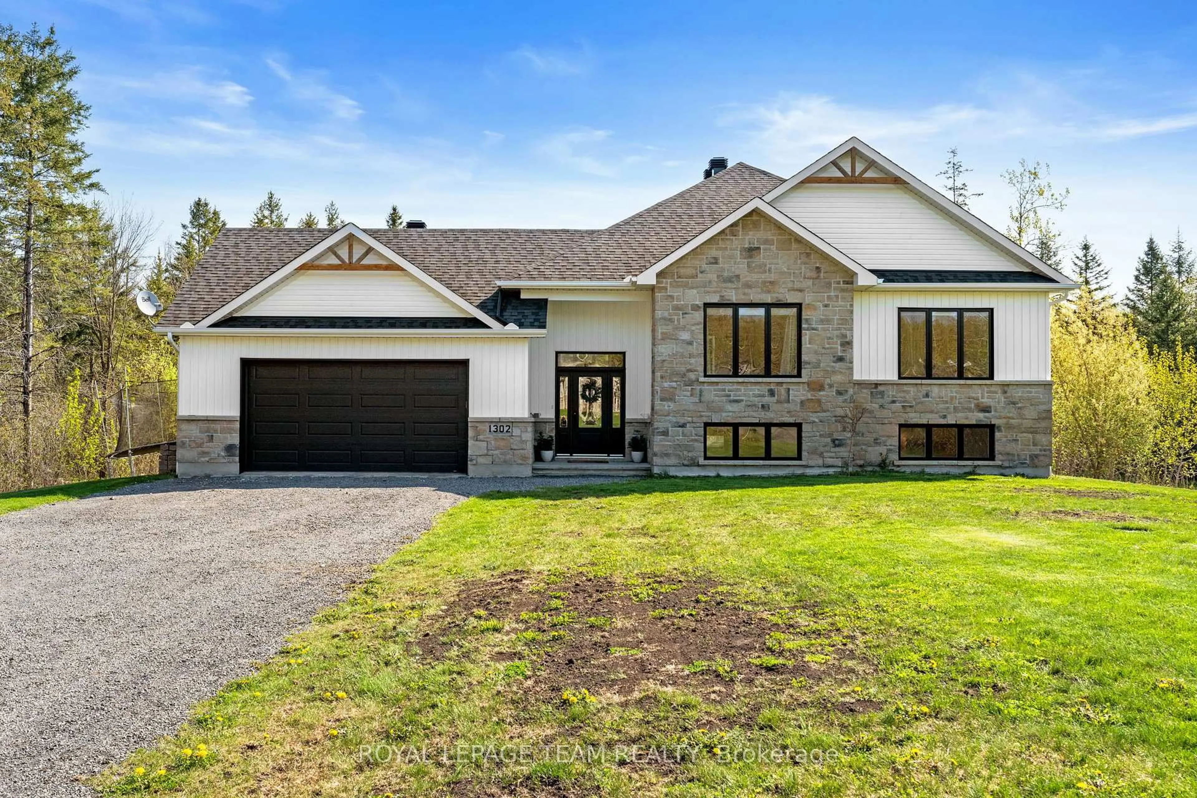 Home with vinyl exterior material, street for 1302 Country Lane, North Dundas Ontario K0C 2K0
