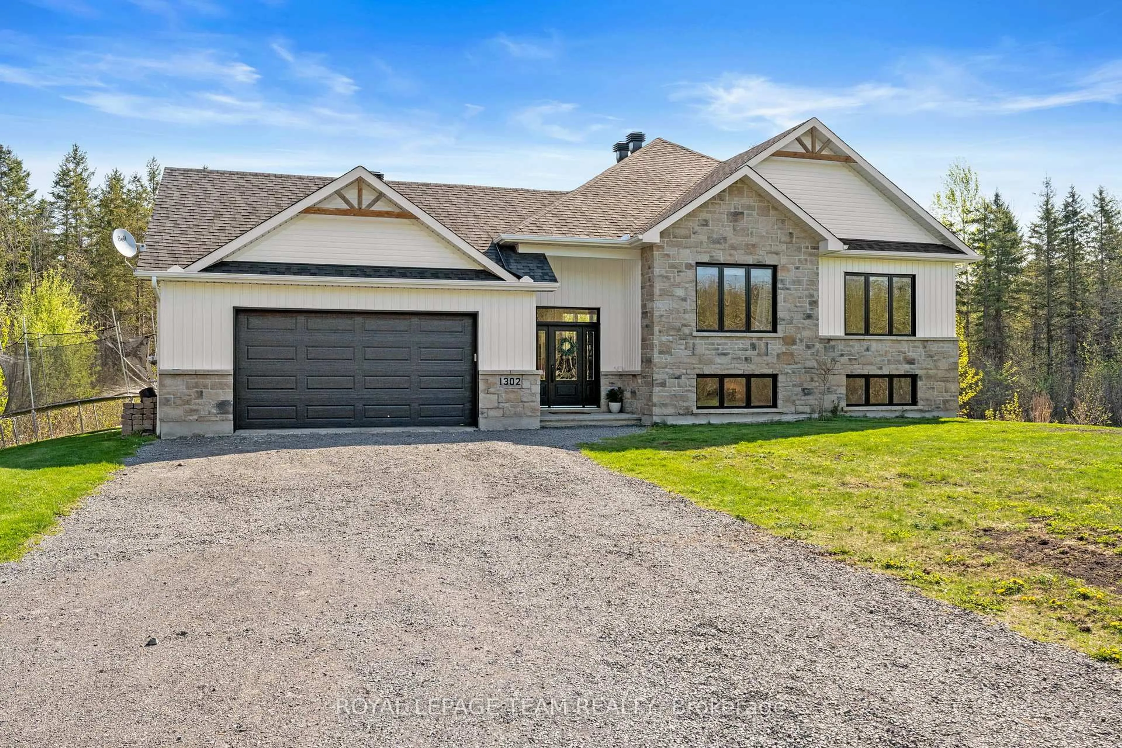 Home with brick exterior material, street for 1302 Country Lane, North Dundas Ontario K0C 2K0