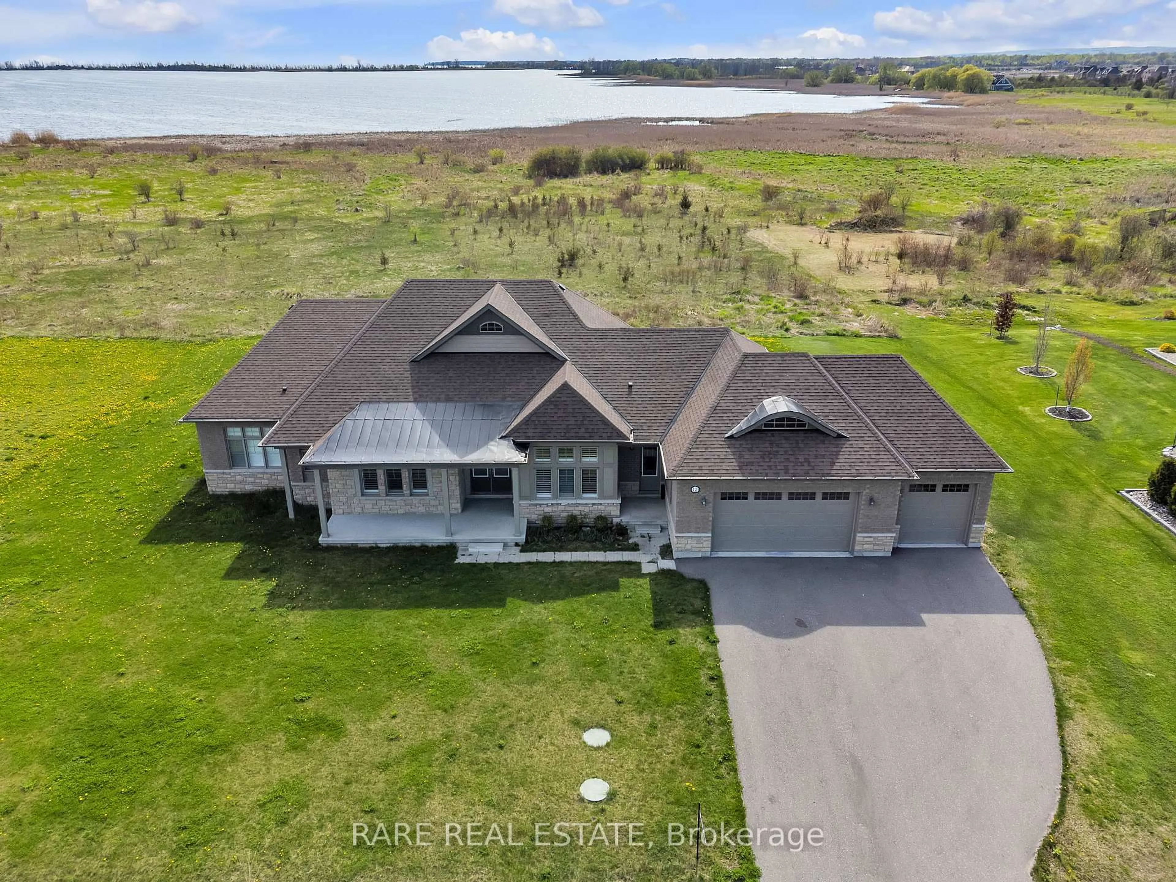 A pic from outside/outdoor area/front of a property/back of a property/a pic from drone, water/lake/river/ocean view for 12 Wellers Way, Quinte West Ontario K0K 1L0