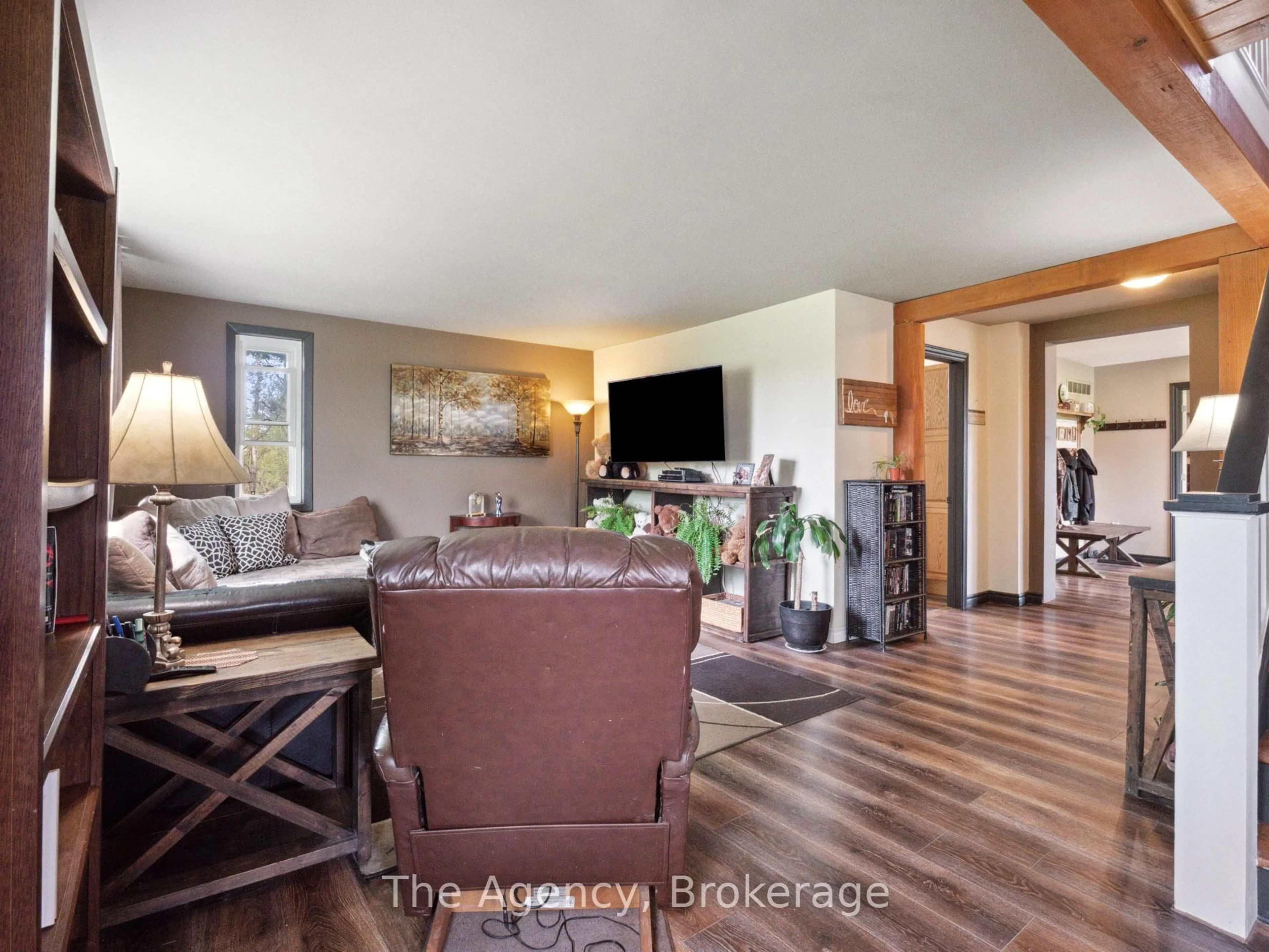 Living room with furniture, wood/laminate floor for 83456 Old River Rd, Wainfleet Ontario L0R 2J0