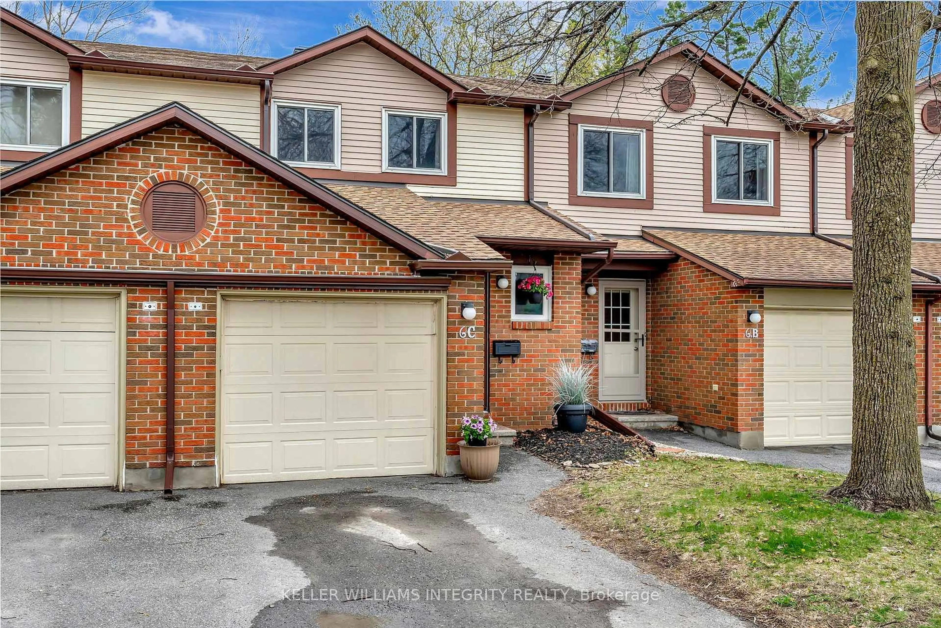 Home with brick exterior material, street for 6 Offenbach Lane #C, Ottawa Ontario K2G 4Z5