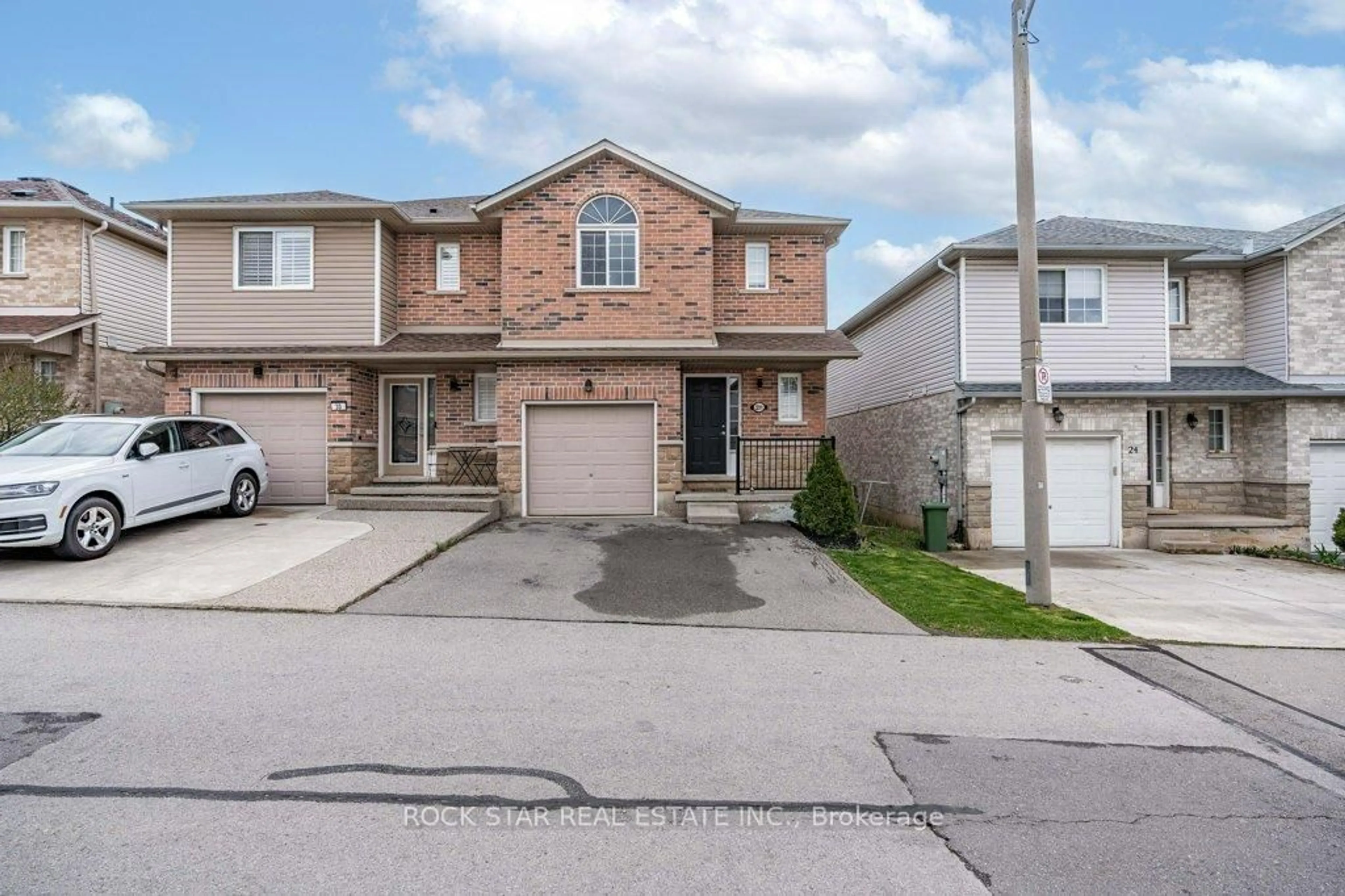 Home with brick exterior material, street for 28 Vennio Lane, Hamilton Ontario L9B 2Y7