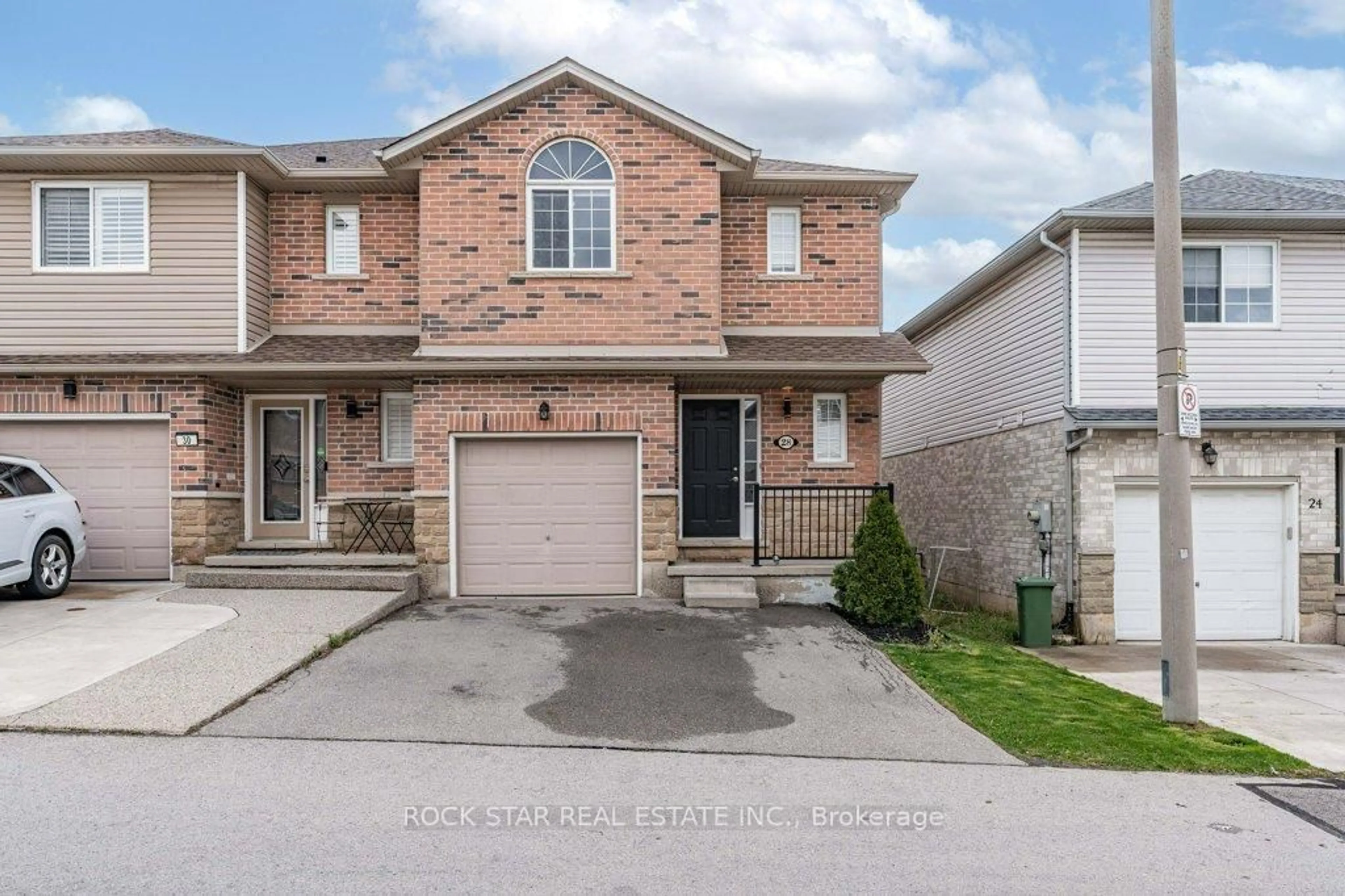 Home with brick exterior material, street for 28 Vennio Lane, Hamilton Ontario L9B 2Y7