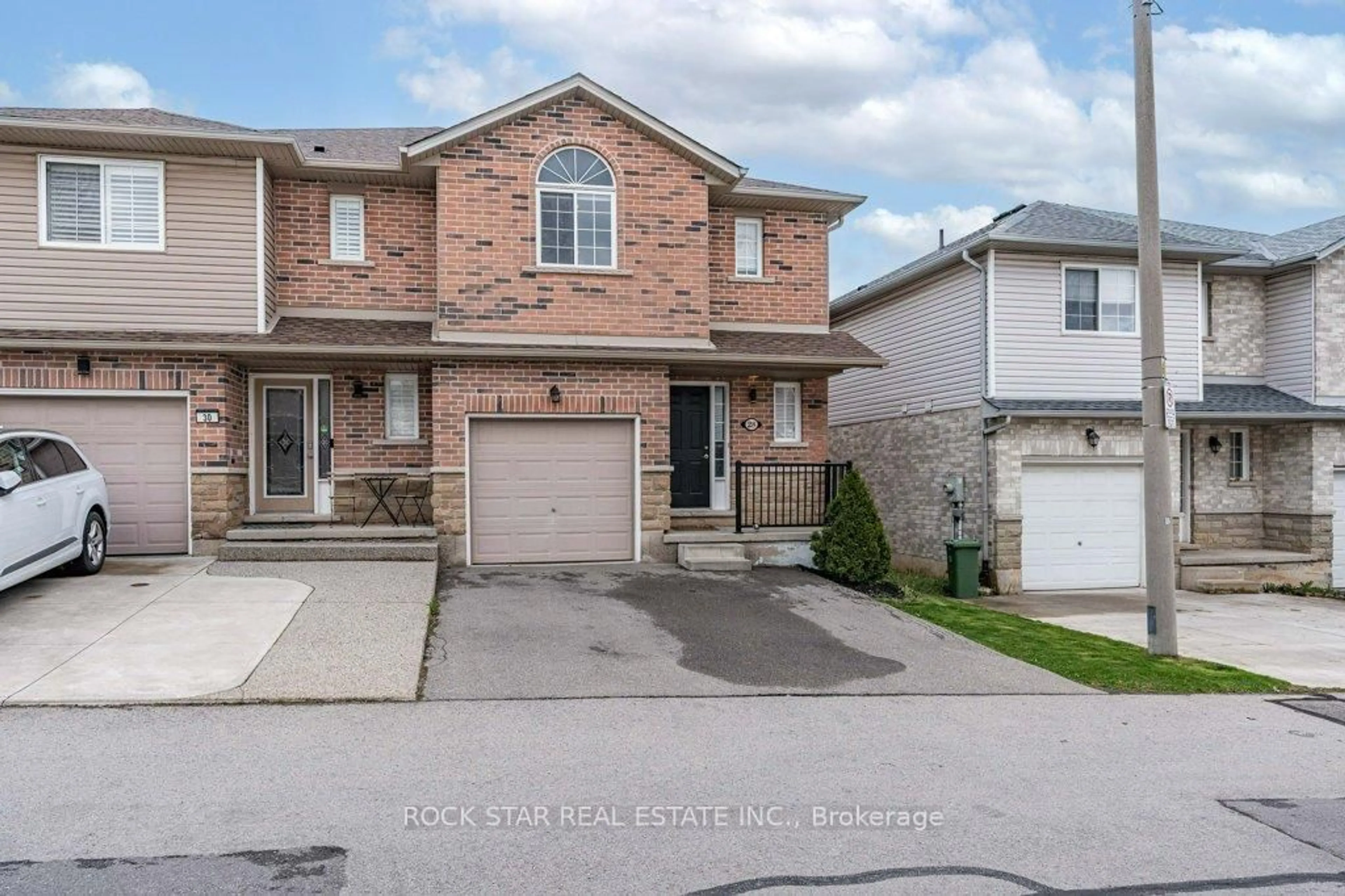 Home with brick exterior material, street for 28 Vennio Lane, Hamilton Ontario L9B 2Y7