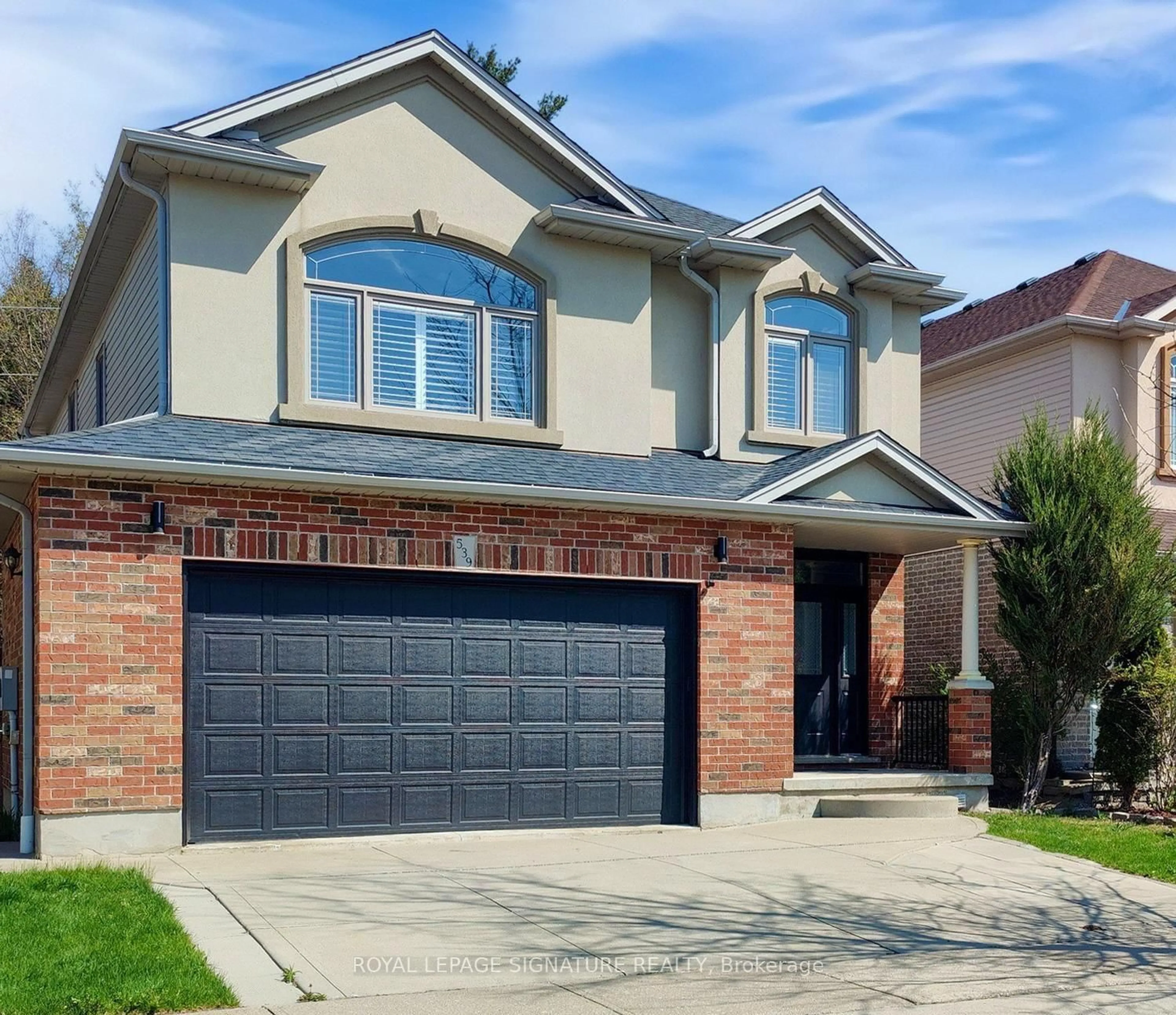 Home with brick exterior material, street for 539 Wood Nettle Way, Waterloo Ontario N2V 2X9