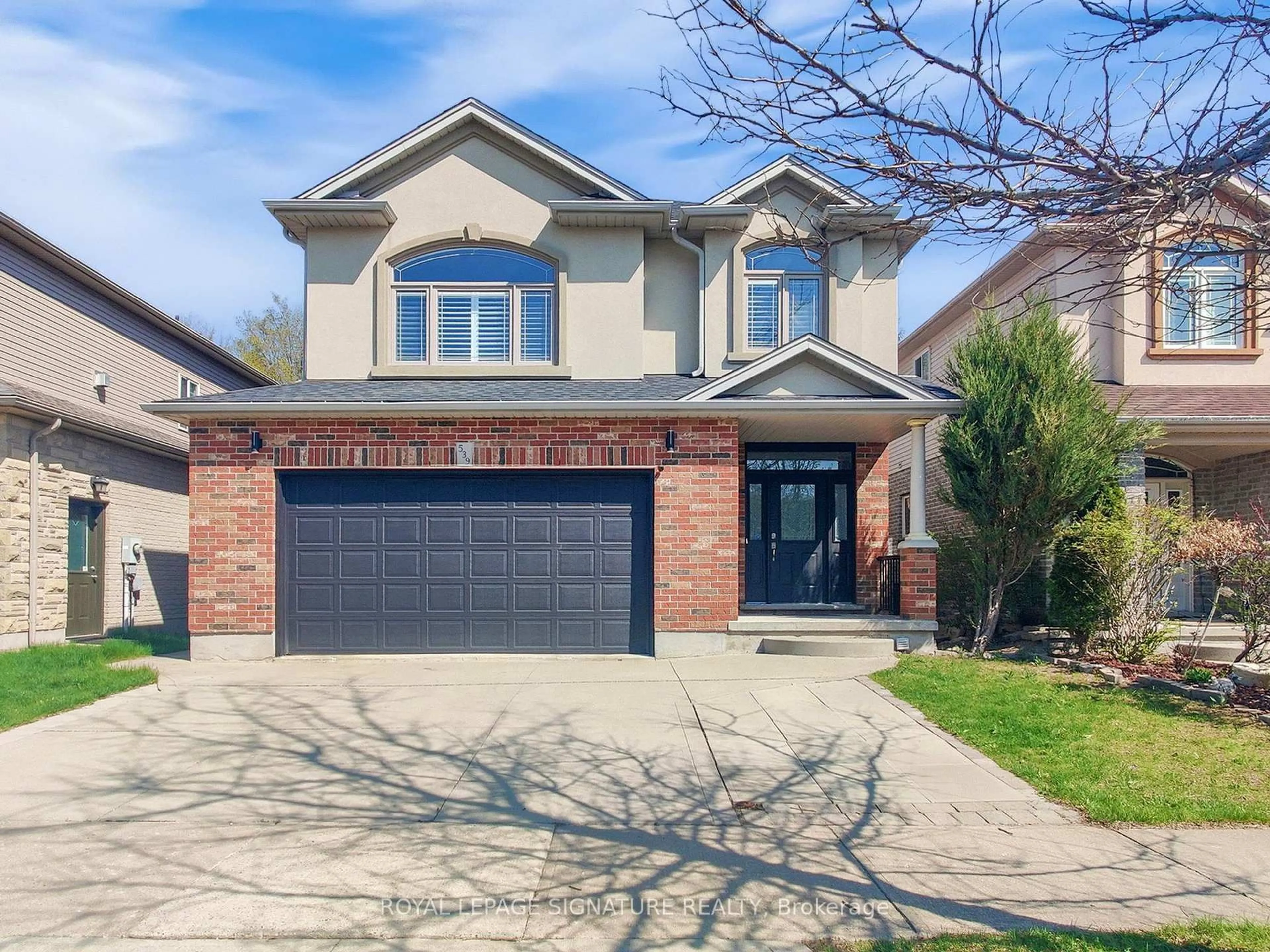 Home with brick exterior material, street for 539 Wood Nettle Way, Waterloo Ontario N2V 2X9