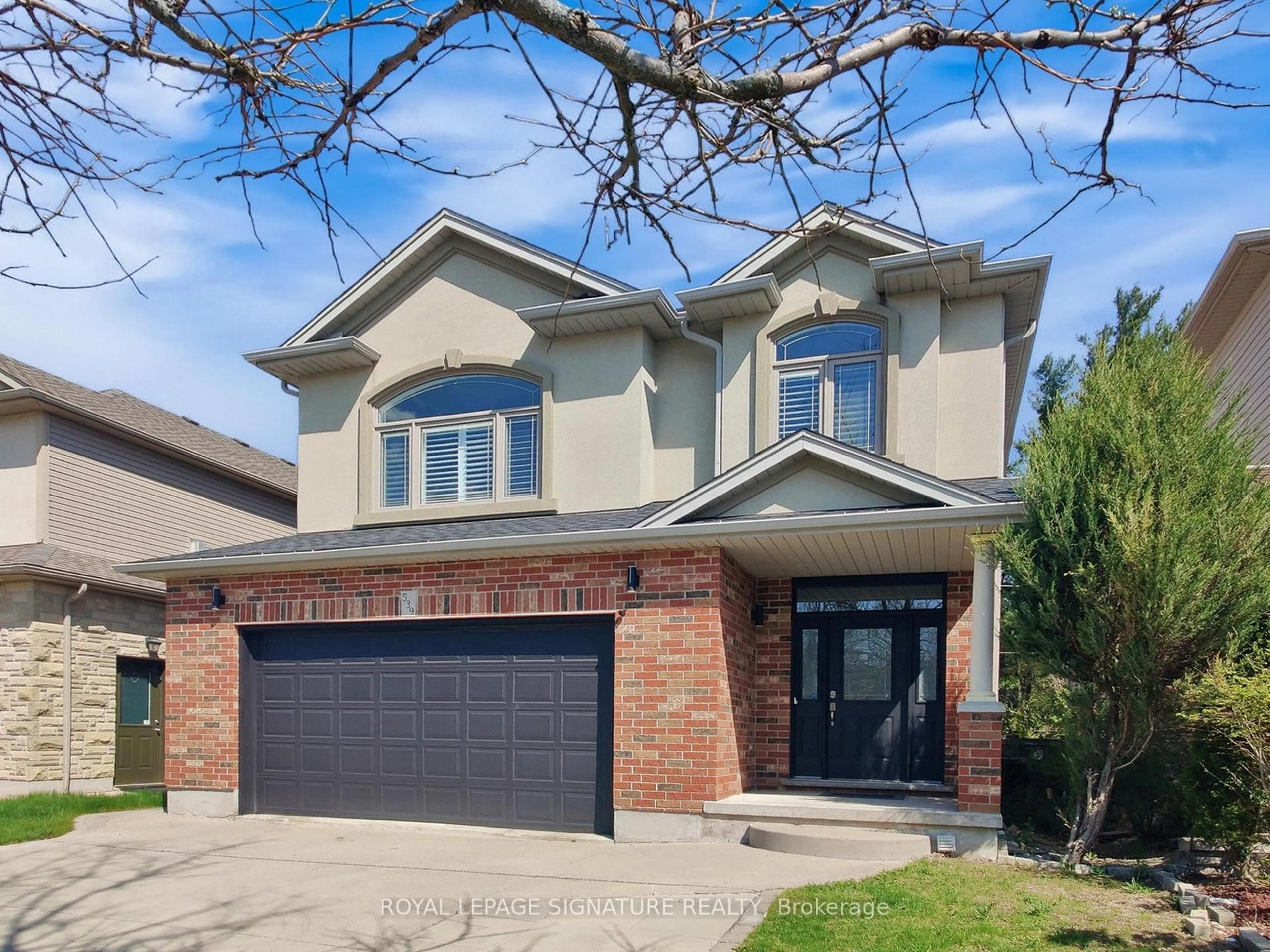 Home with brick exterior material, street for 539 Wood Nettle Way, Waterloo Ontario N2V 2X9