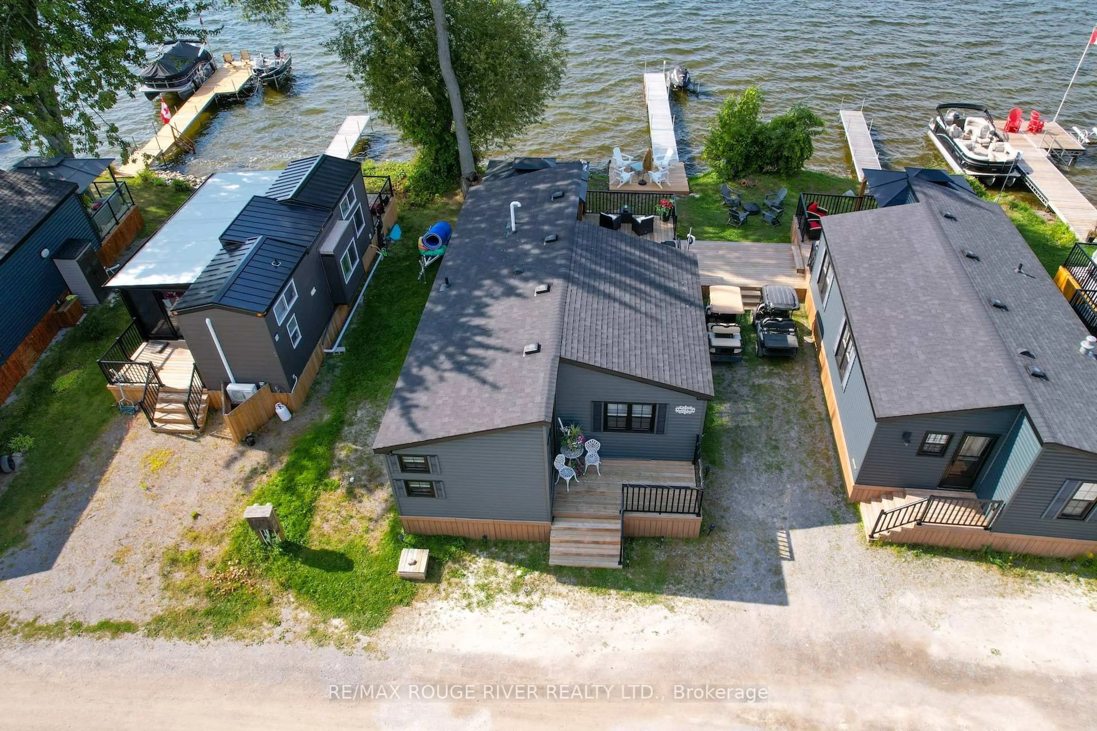 A pic from outside/outdoor area/front of a property/back of a property/a pic from drone, water/lake/river/ocean view for 7100 County Rd 18 #21W, Alnwick/Haldimand Ontario K0K 2X0