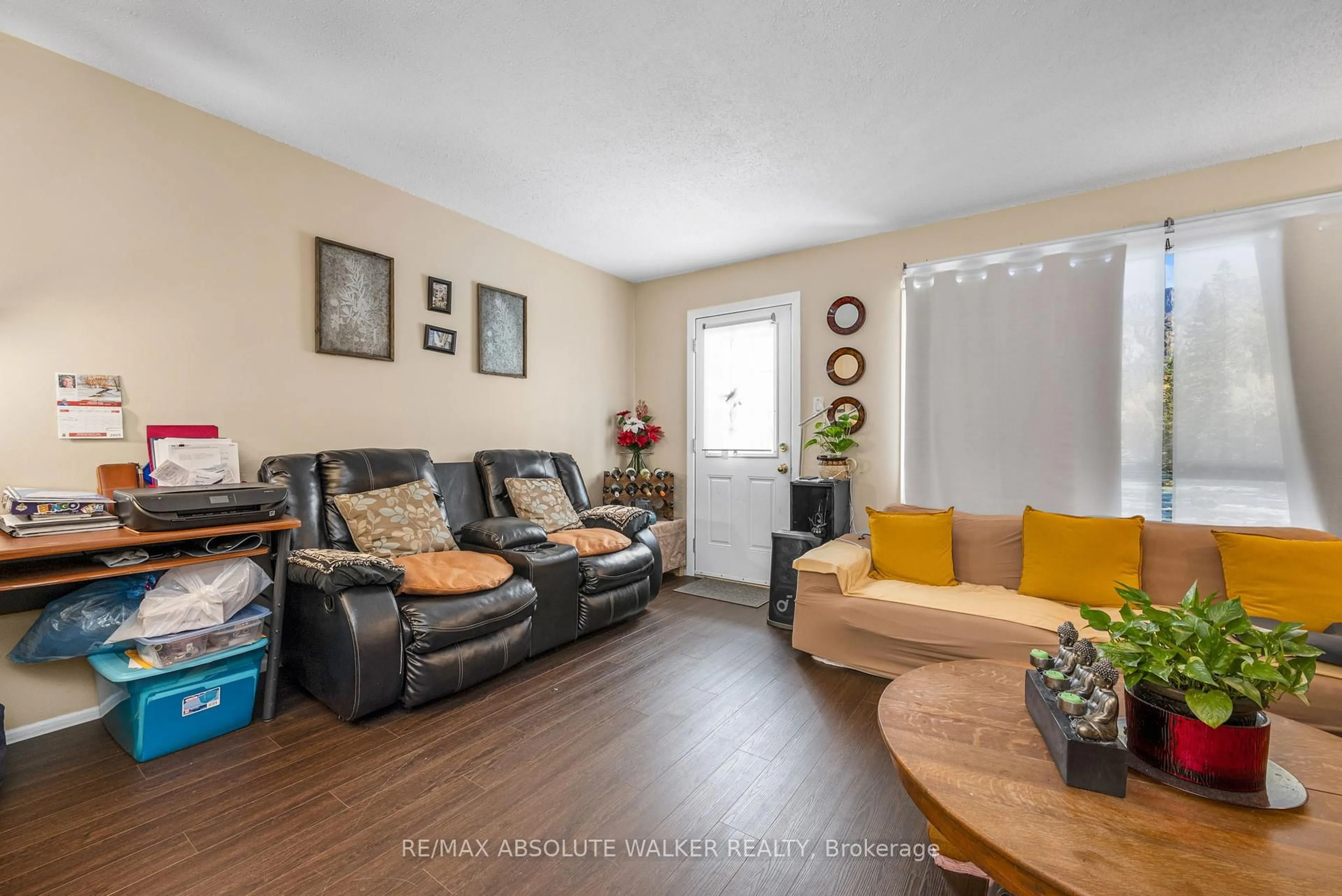 Living room with furniture, wood/laminate floor for 25A Sonnet Cres, Ottawa Ontario K2H 8W8