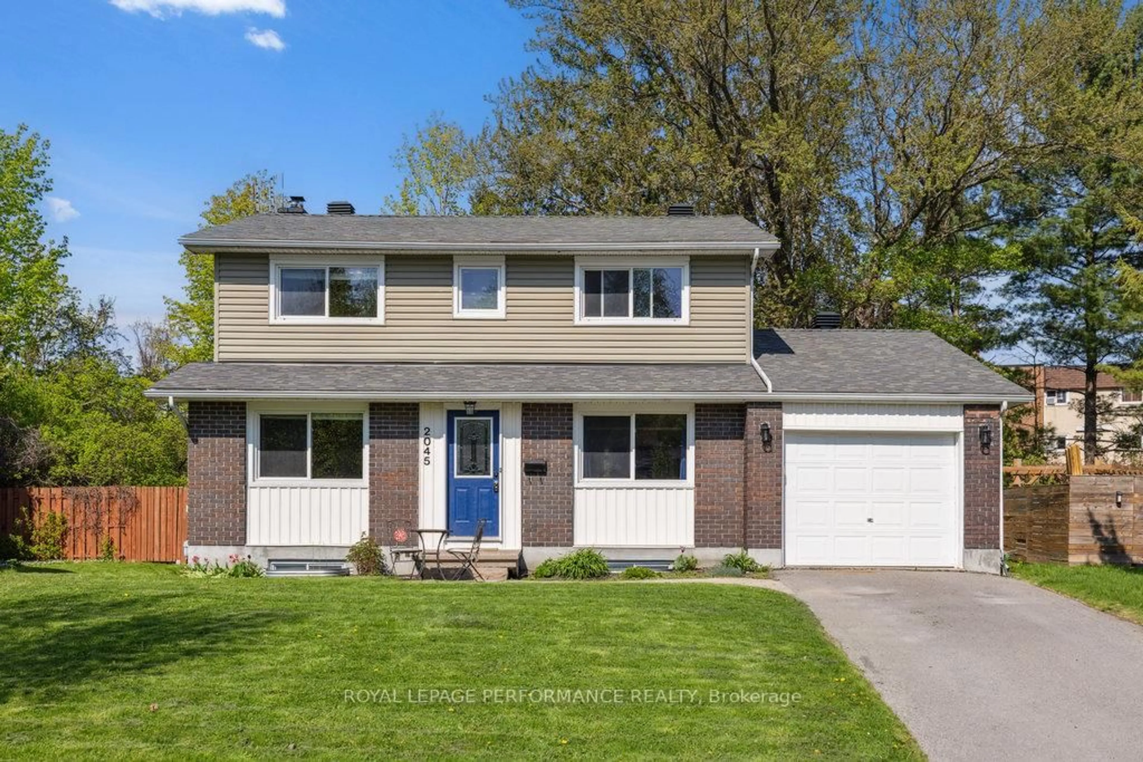 Home with vinyl exterior material, street for 2045 Deerhurst Crt, Ottawa Ontario K1J 8H2