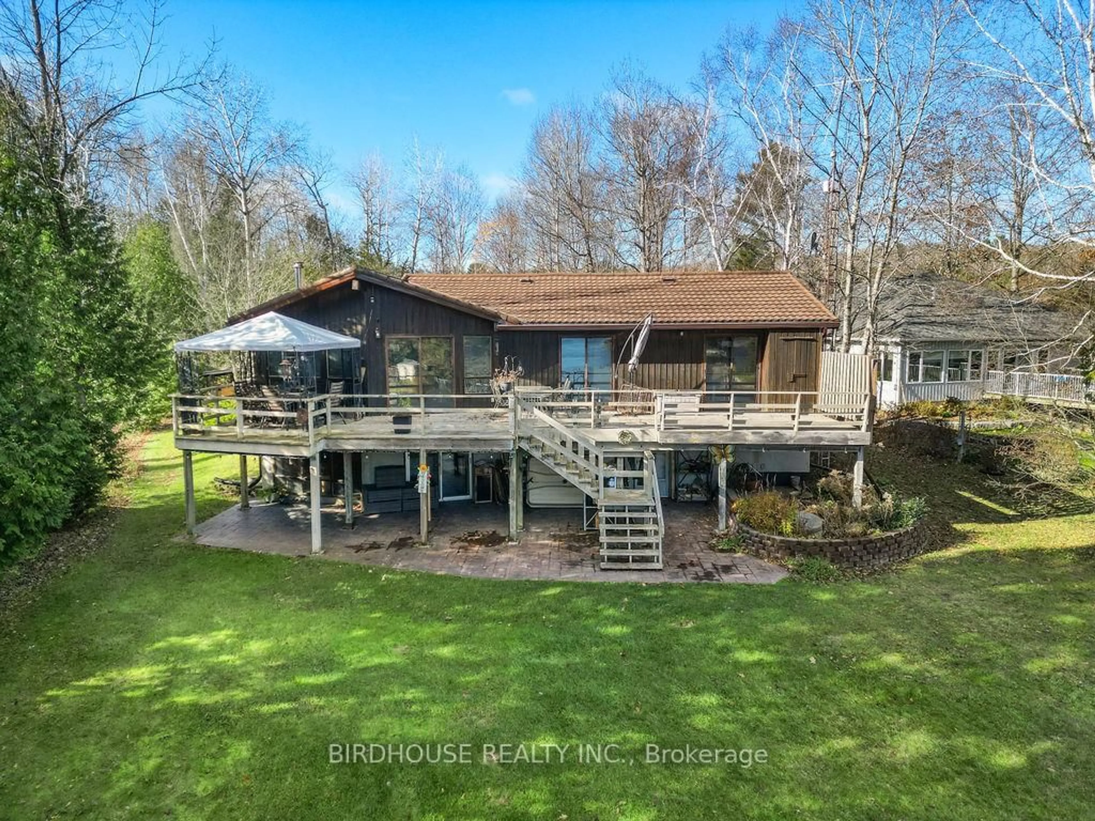 A pic from outside/outdoor area/front of a property/back of a property/a pic from drone, water/lake/river/ocean view for 217 Adam & Eve Rd, Trent Lakes Ontario K0L 1J0