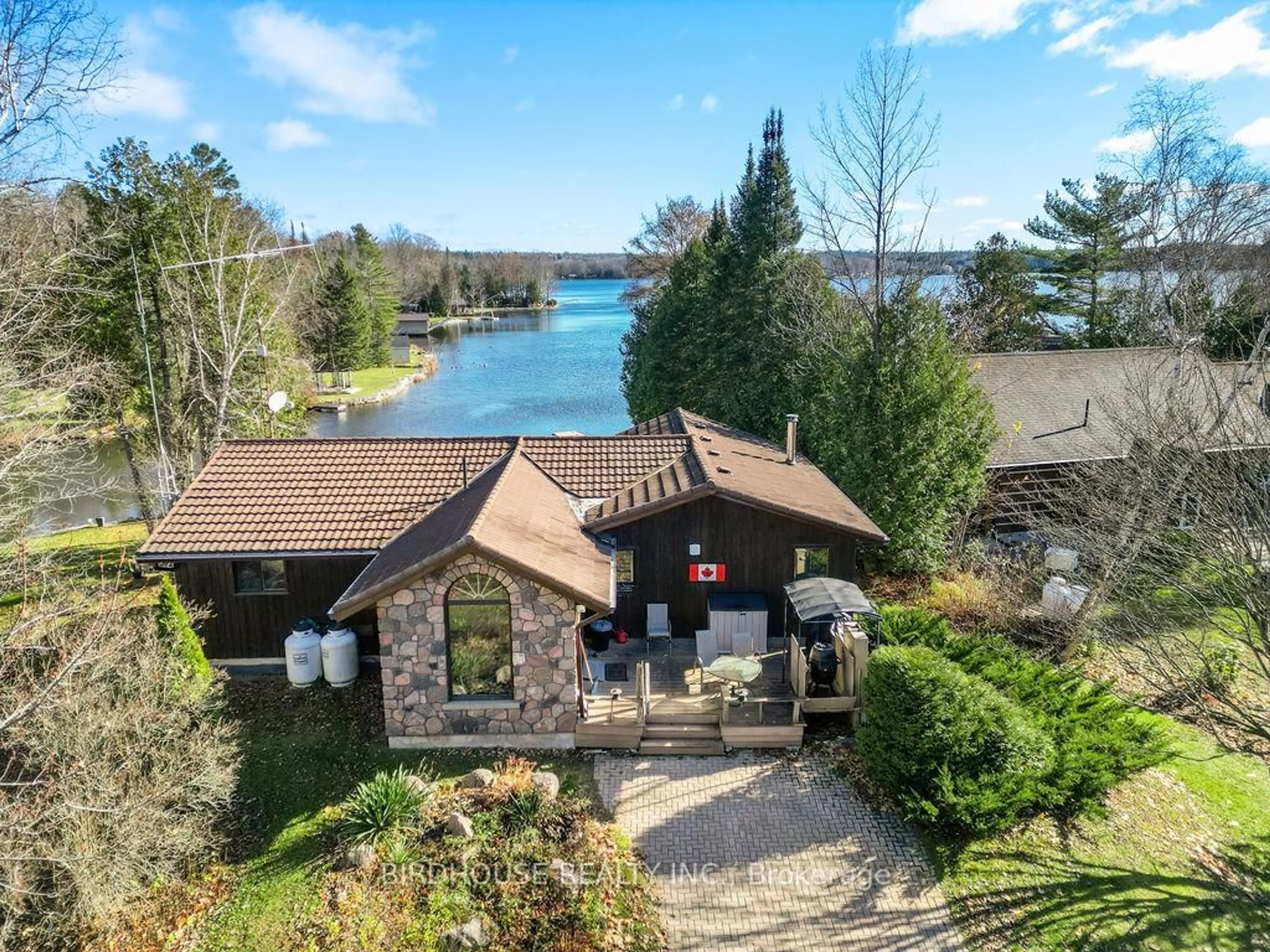 A pic from outside/outdoor area/front of a property/back of a property/a pic from drone, water/lake/river/ocean view for 217 Adam & Eve Rd, Trent Lakes Ontario K0L 1J0