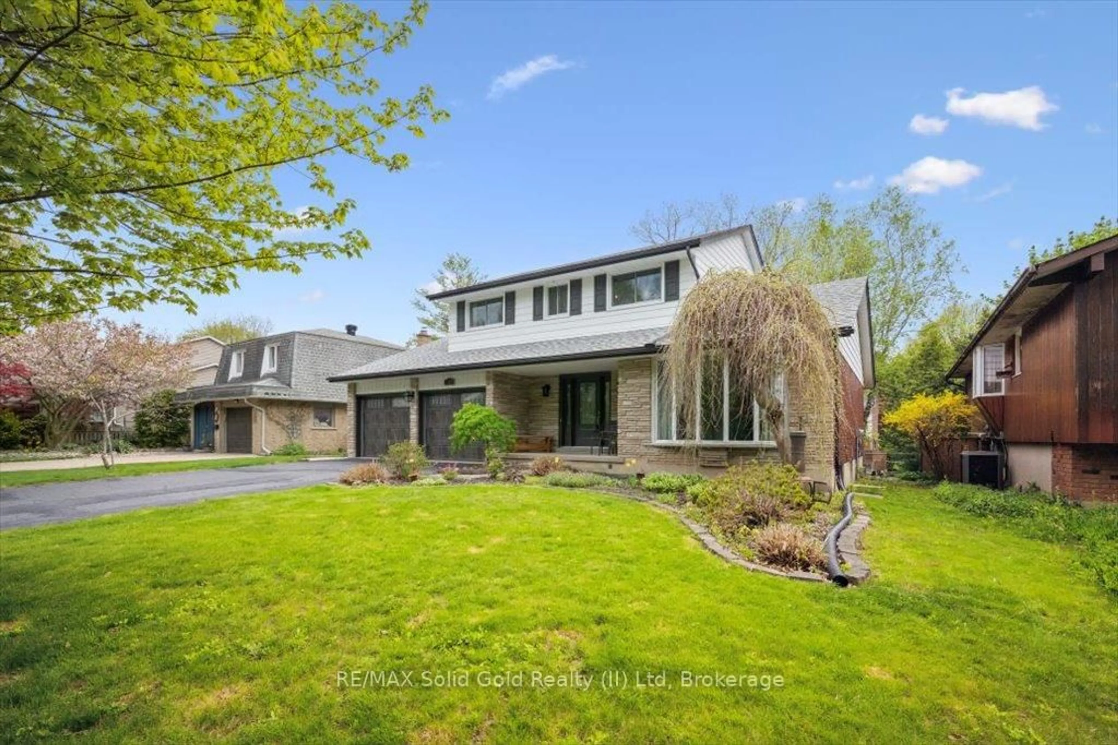 Home with brick exterior material, street for 312 Craigleith Dr, Waterloo Ontario N2L 5B3
