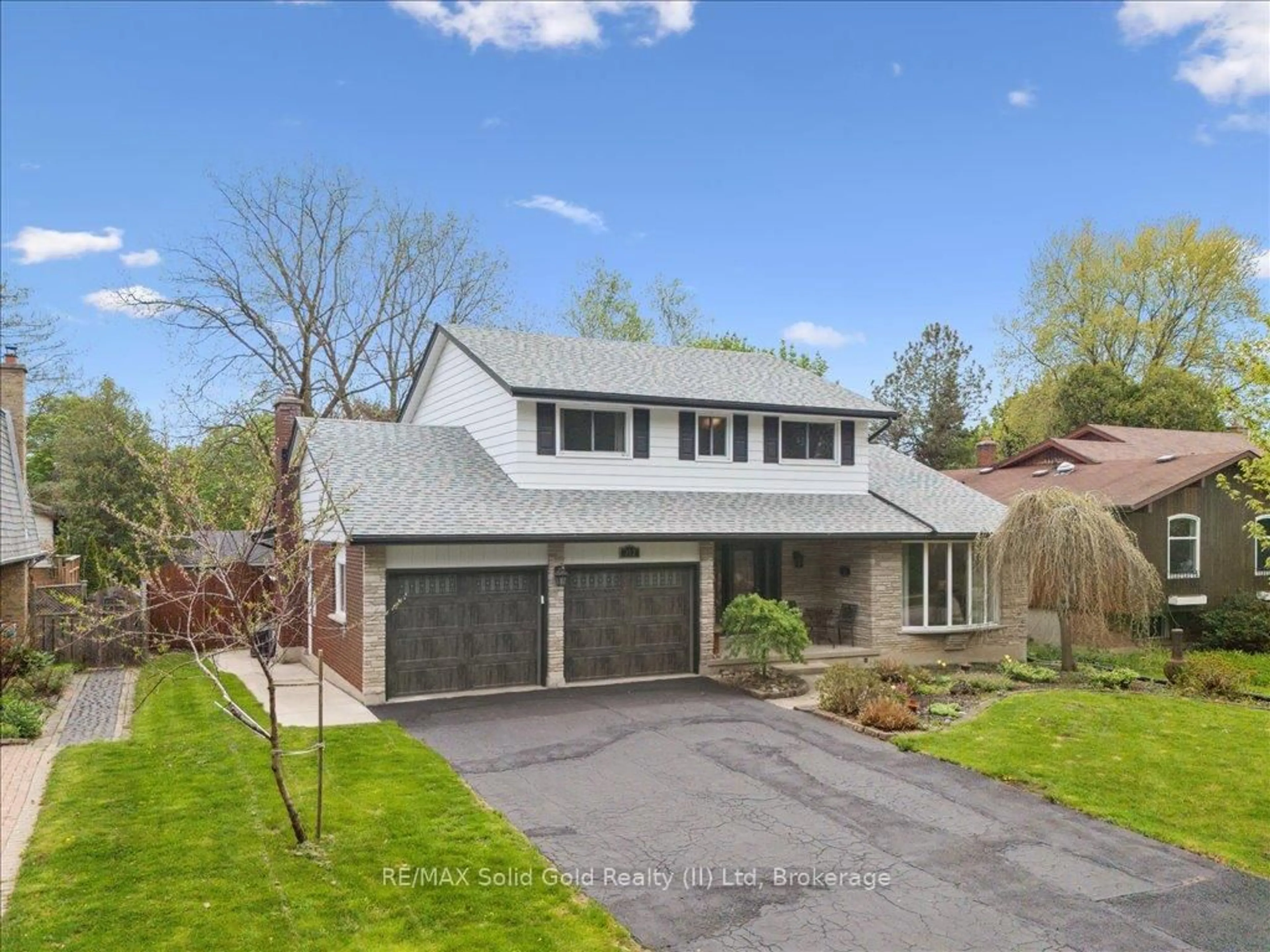 Home with brick exterior material, street for 312 Craigleith Dr, Waterloo Ontario N2L 5B3