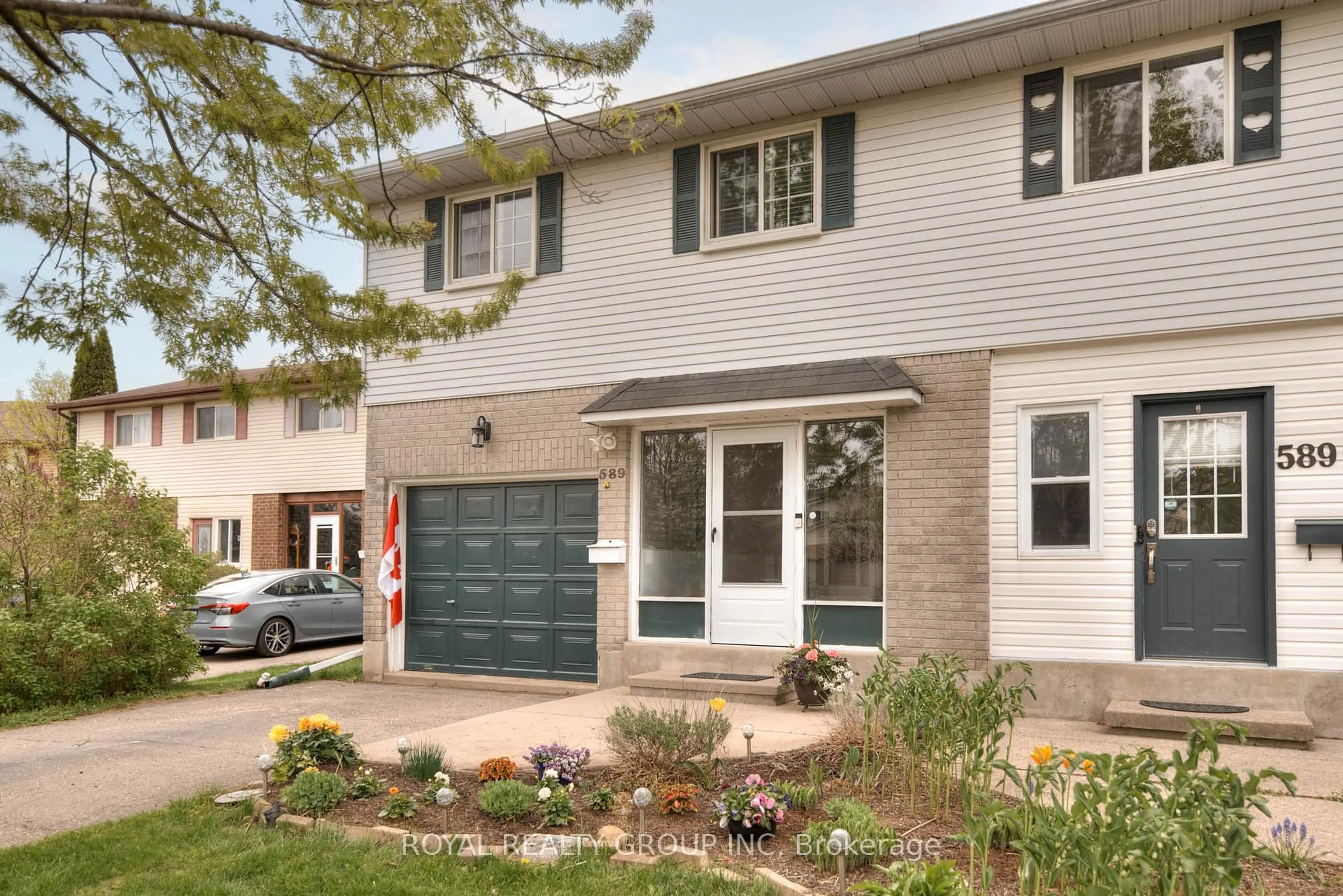 Home with brick exterior material, street for 589 Pinerow Crt #A, Waterloo Ontario N2K 2K5