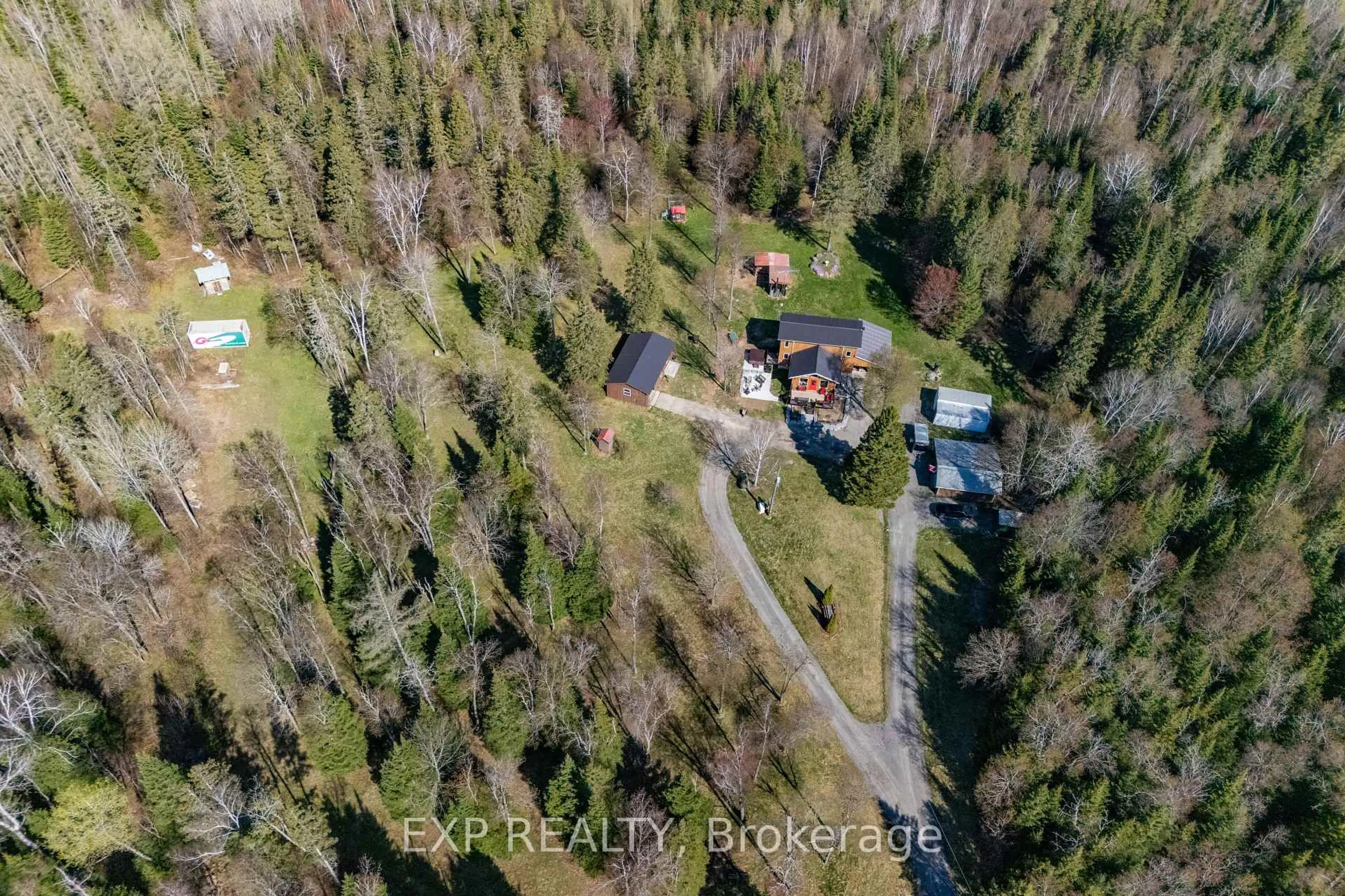A pic from outside/outdoor area/front of a property/back of a property/a pic from drone, forest/trees view for 5490 Loop Rd, Highlands East Ontario K0L 2A0