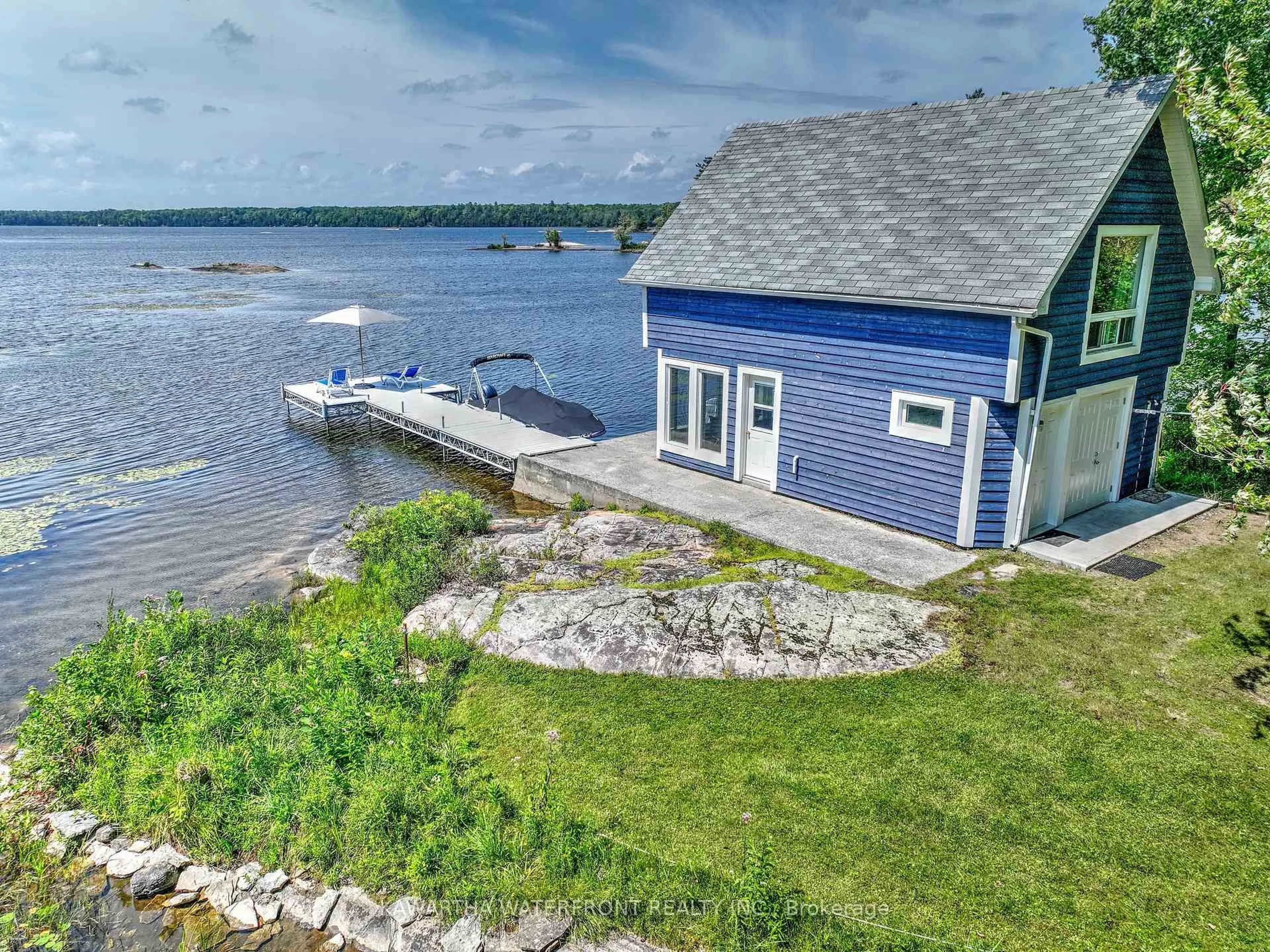 A pic from outside/outdoor area/front of a property/back of a property/a pic from drone, water/lake/river/ocean view for 11 Woodworth Dr, Kawartha Lakes Ontario K0M 1A0
