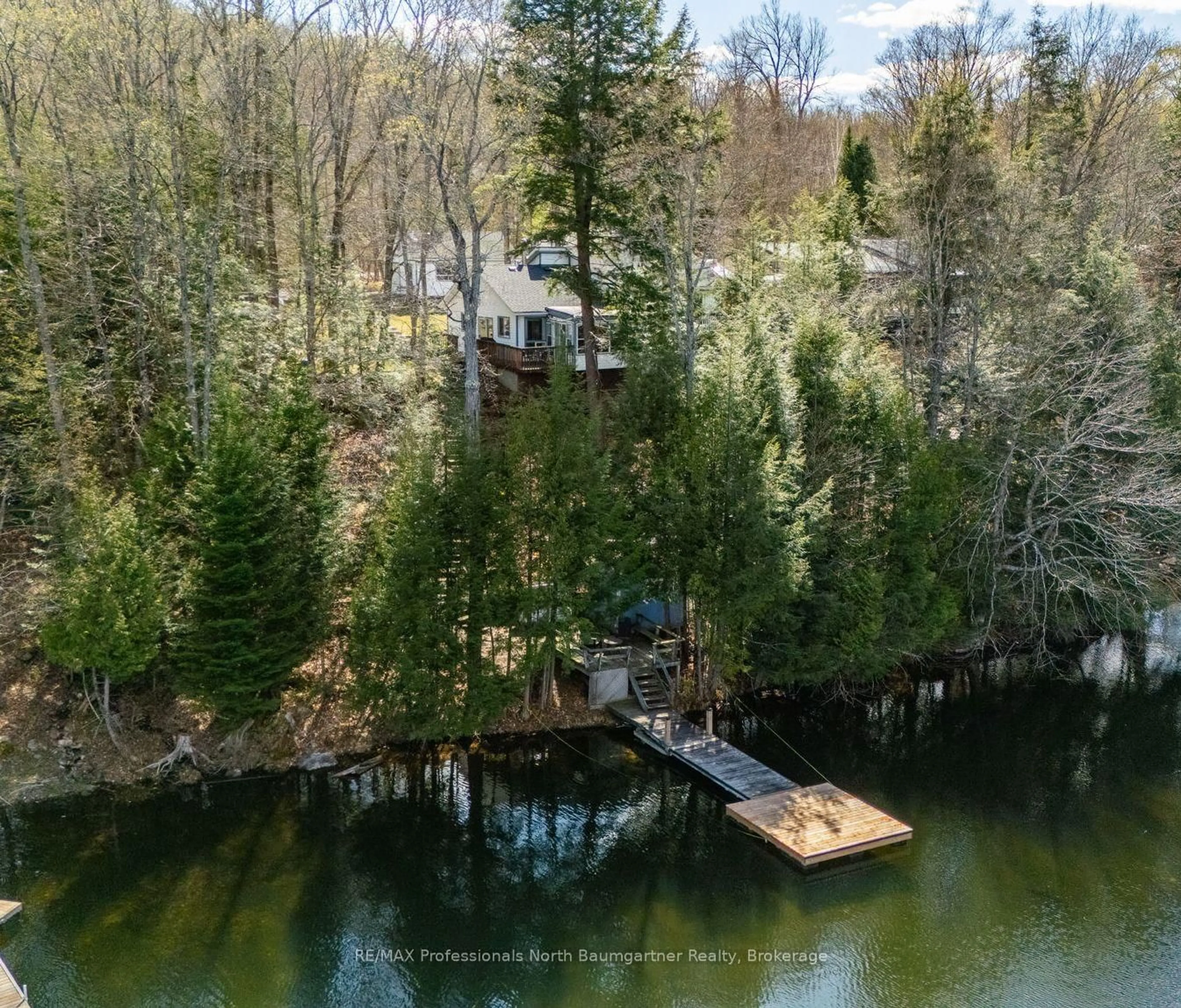 A pic from outside/outdoor area/front of a property/back of a property/a pic from drone, water/lake/river/ocean view for 1053 Mink Rd, Dysart et al Ontario K0M 1S0