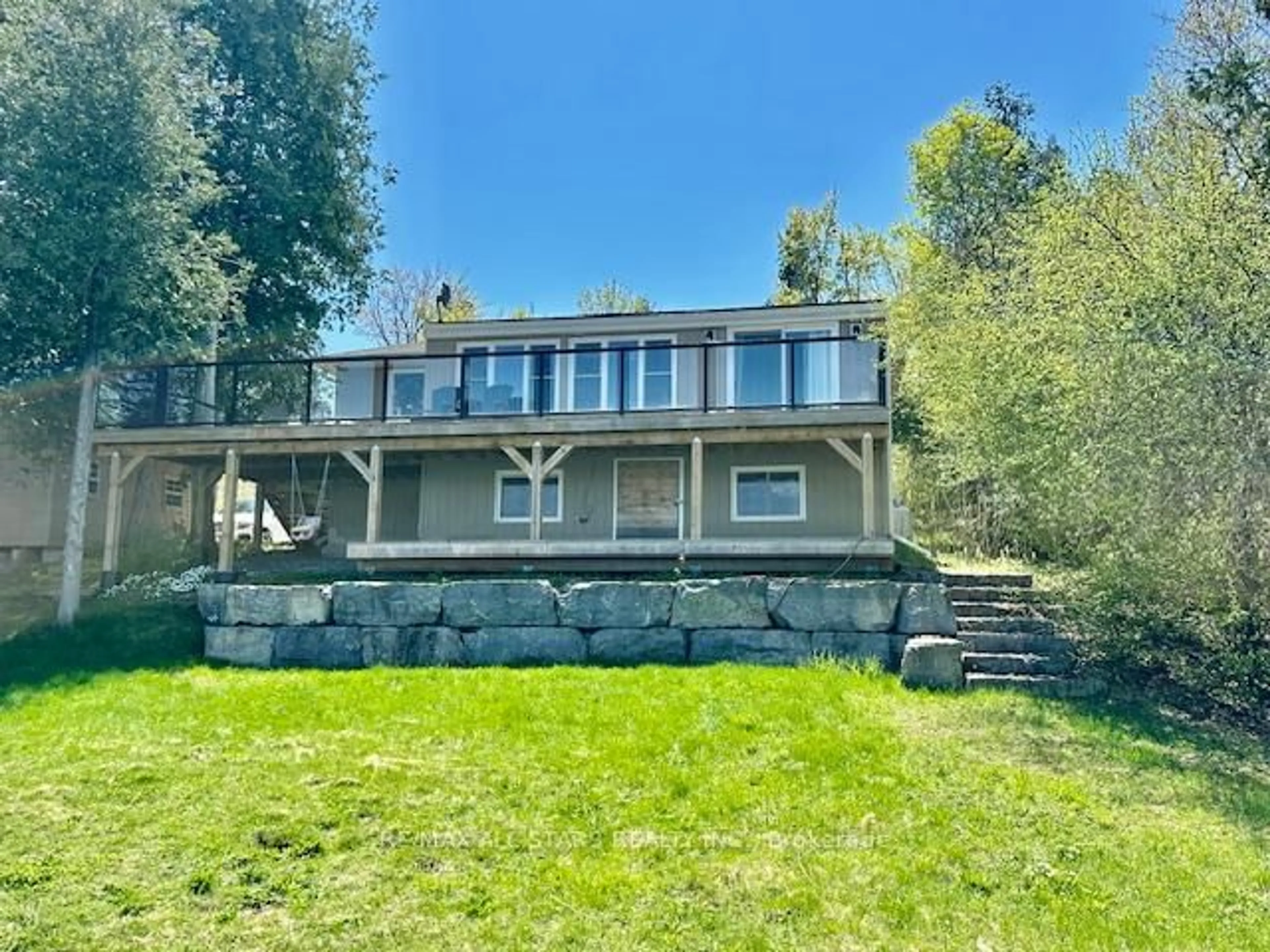 A pic from outside/outdoor area/front of a property/back of a property/a pic from drone, water/lake/river/ocean view for 15 Manchester Tr, Kawartha Lakes Ontario K0M 1A0