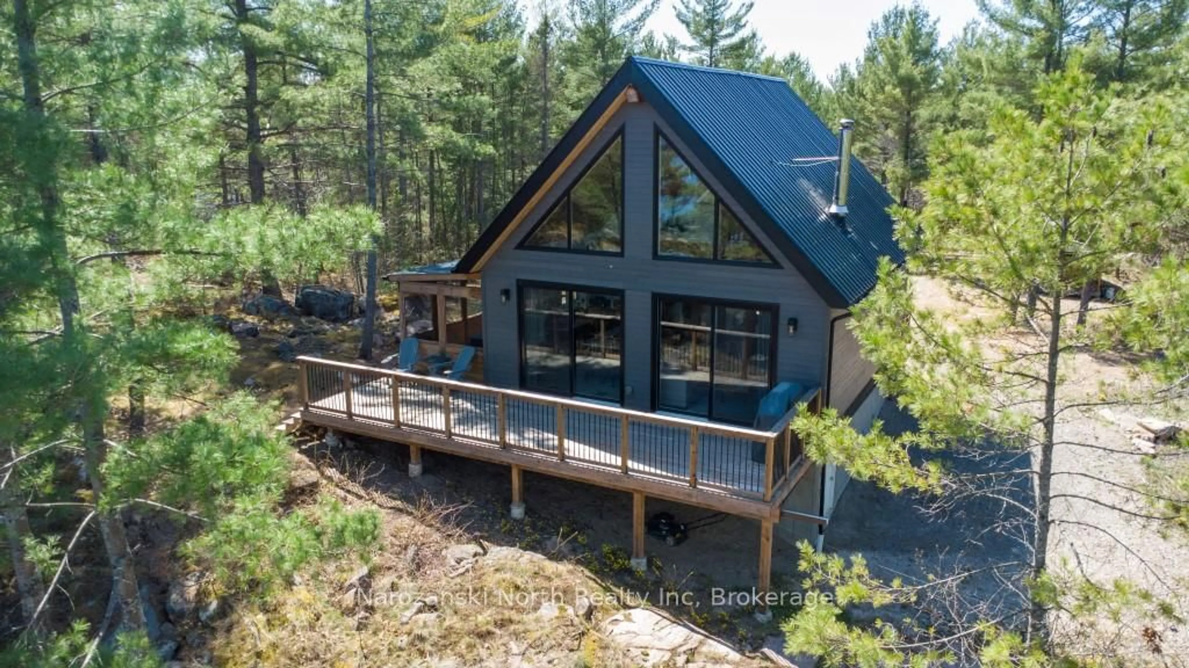 A pic from outside/outdoor area/front of a property/back of a property/a pic from drone, water/lake/river/ocean view for 118 B Plouffe Rd, French River Ontario P0M 2N0