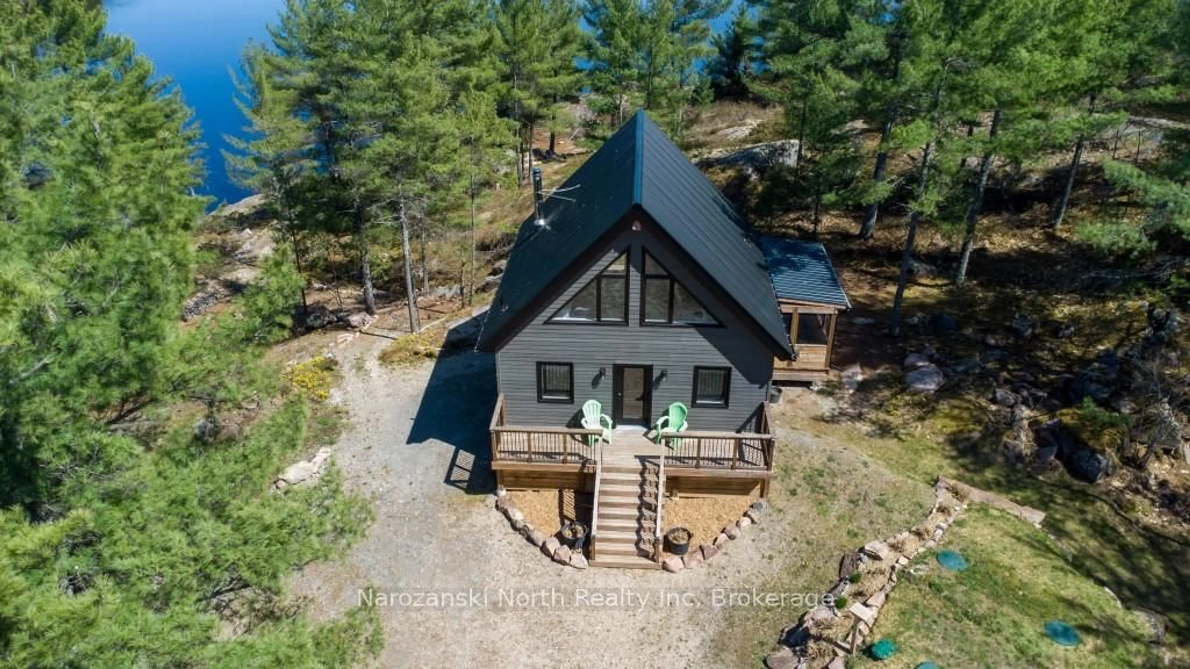 A pic from outside/outdoor area/front of a property/back of a property/a pic from drone, water/lake/river/ocean view for 118 B Plouffe Rd, French River Ontario P0M 2N0
