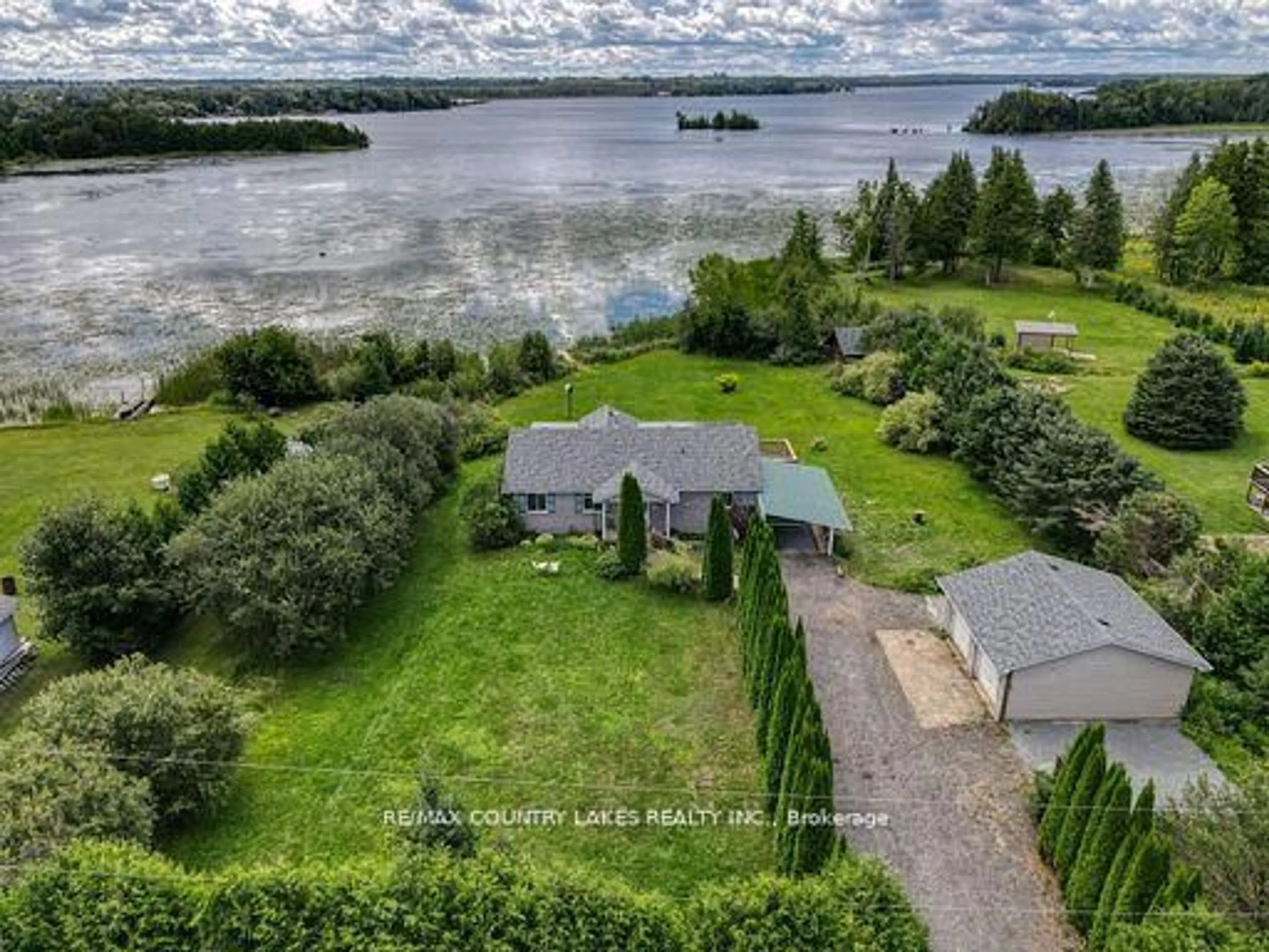 A pic from outside/outdoor area/front of a property/back of a property/a pic from drone, water/lake/river/ocean view for 586 Rohallion Rd, Kawartha Lakes Ontario L0K 1B0