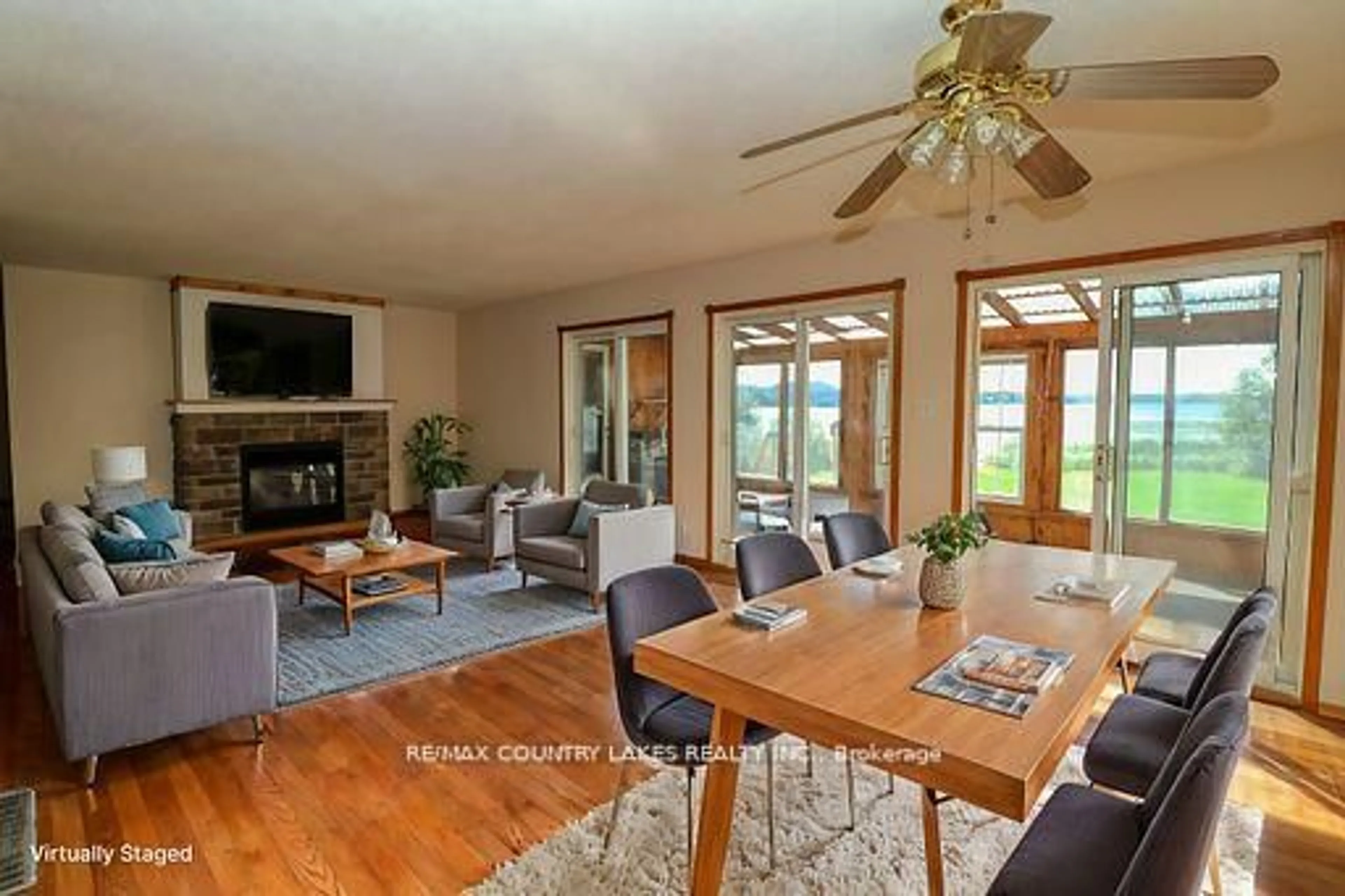 Living room with furniture, wood/laminate floor for 586 Rohallion Rd, Kawartha Lakes Ontario L0K 1B0