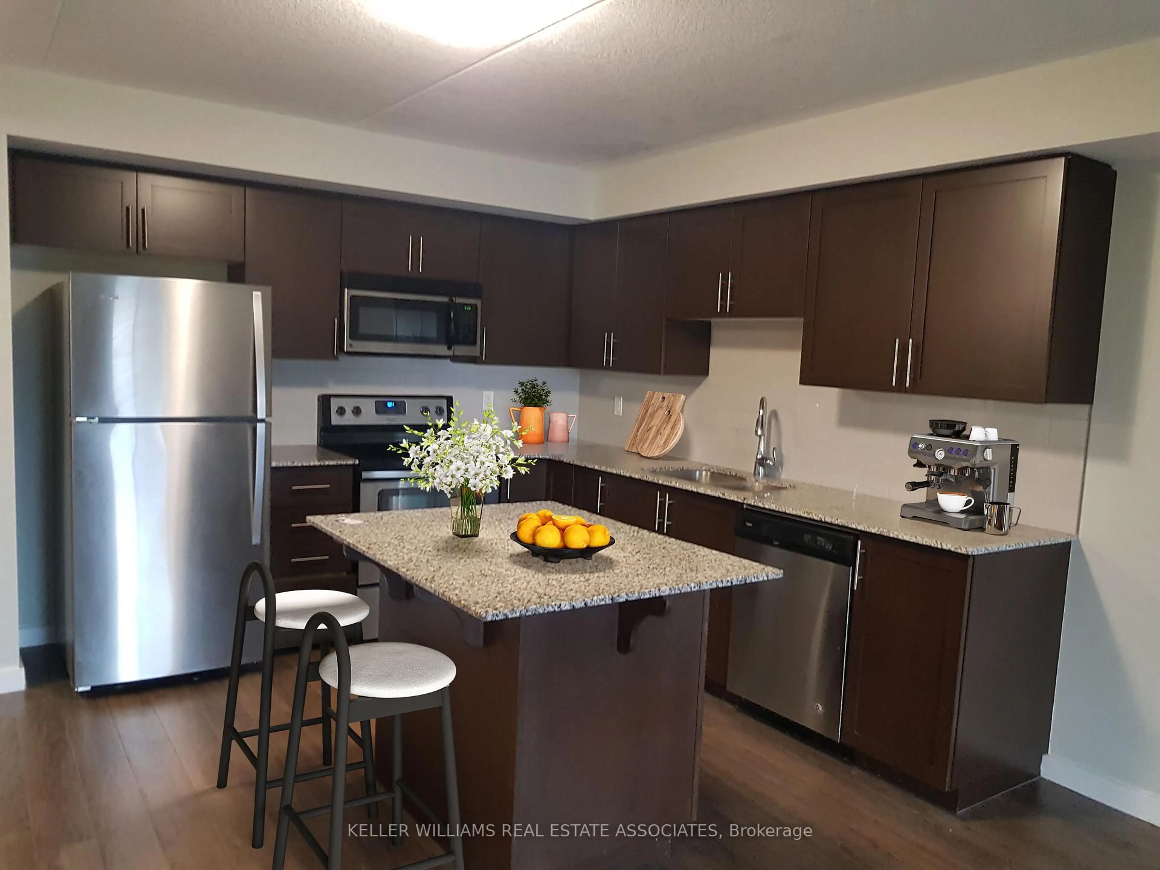 Open concept kitchen, wood/laminate floor for 25 Kay Cres #306, Guelph Ontario N1L 0P2